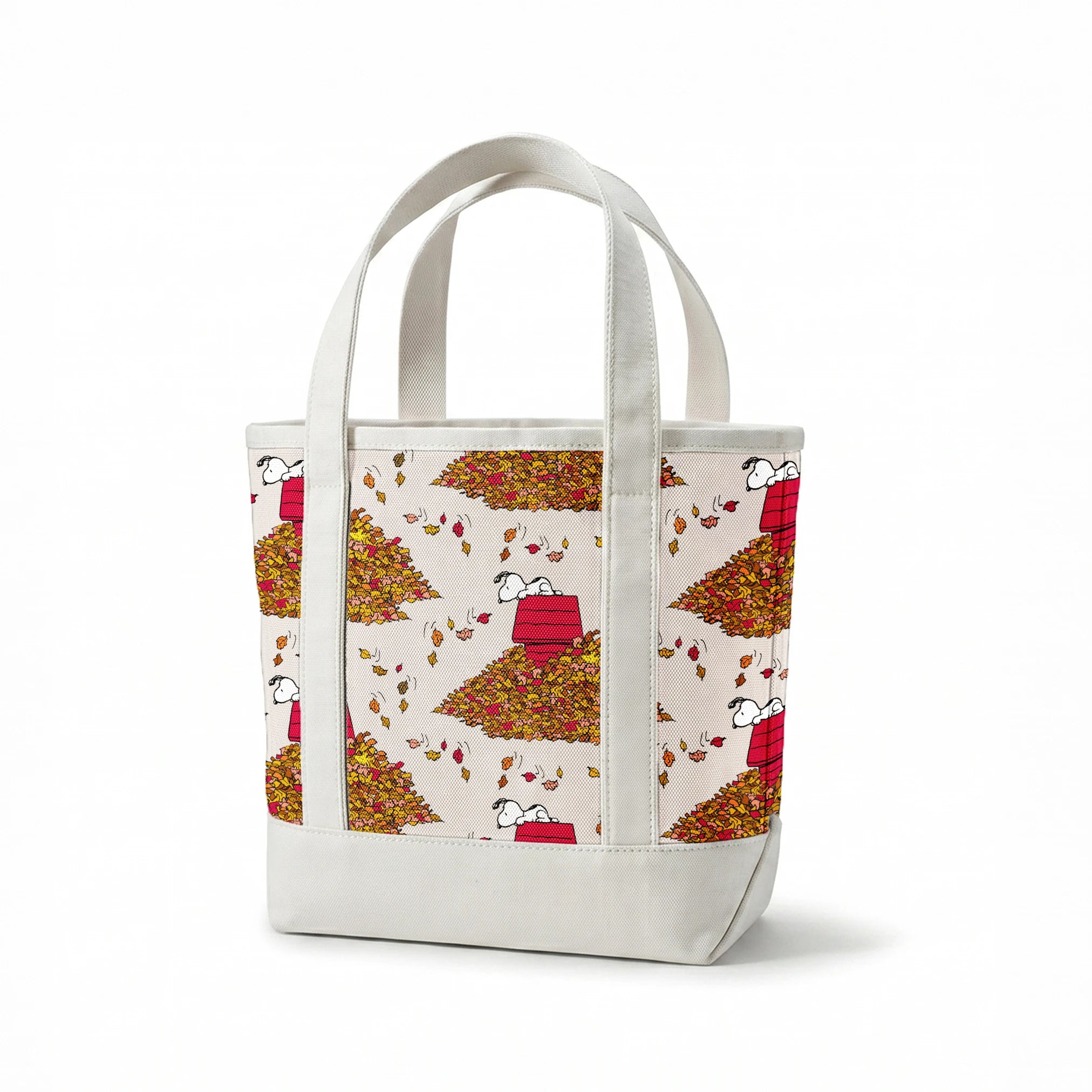 Snoopy and red doghouse on colorful autumn leaf piles with falling leaves pattern on beige background springs canvastote mockup