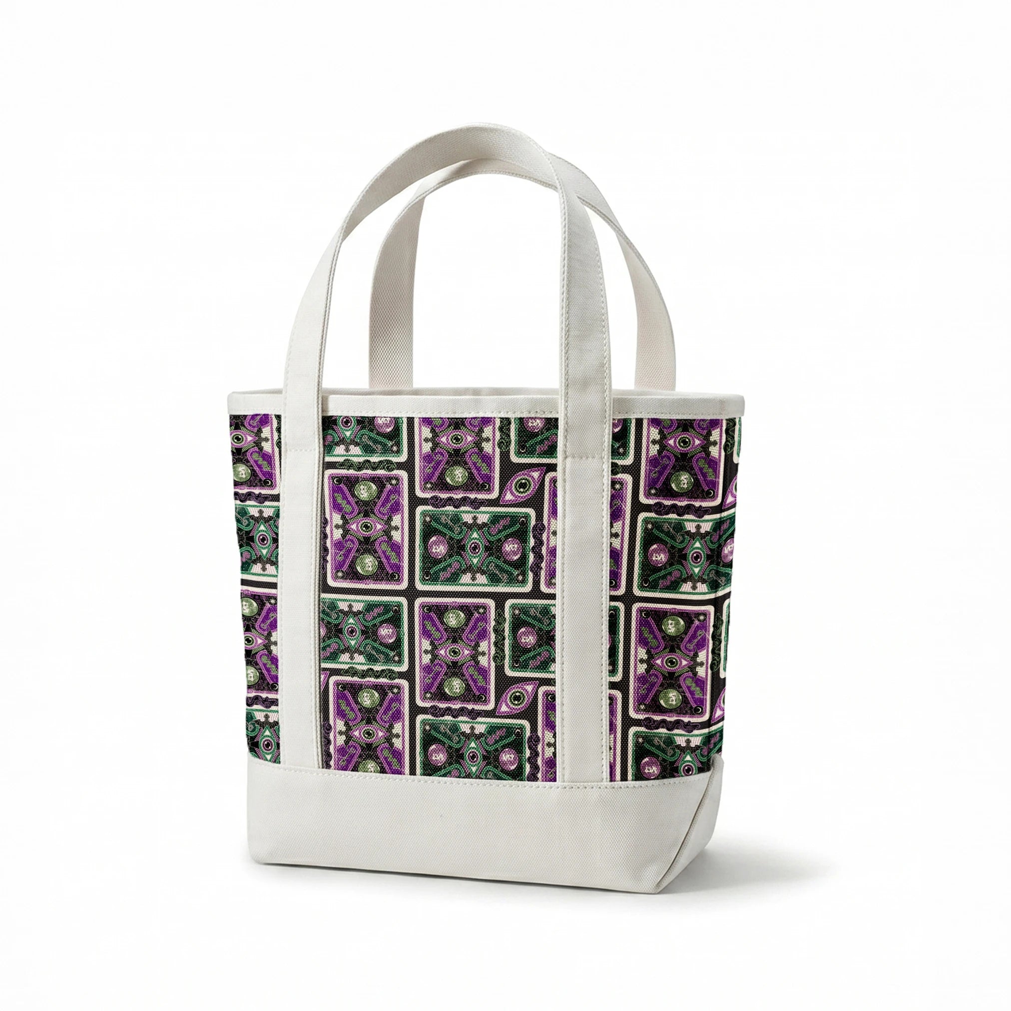 Ornate playing card designs with purple and green patterns featuring central eye motifs and circular number elements against a black background. springs canvastote mockup
