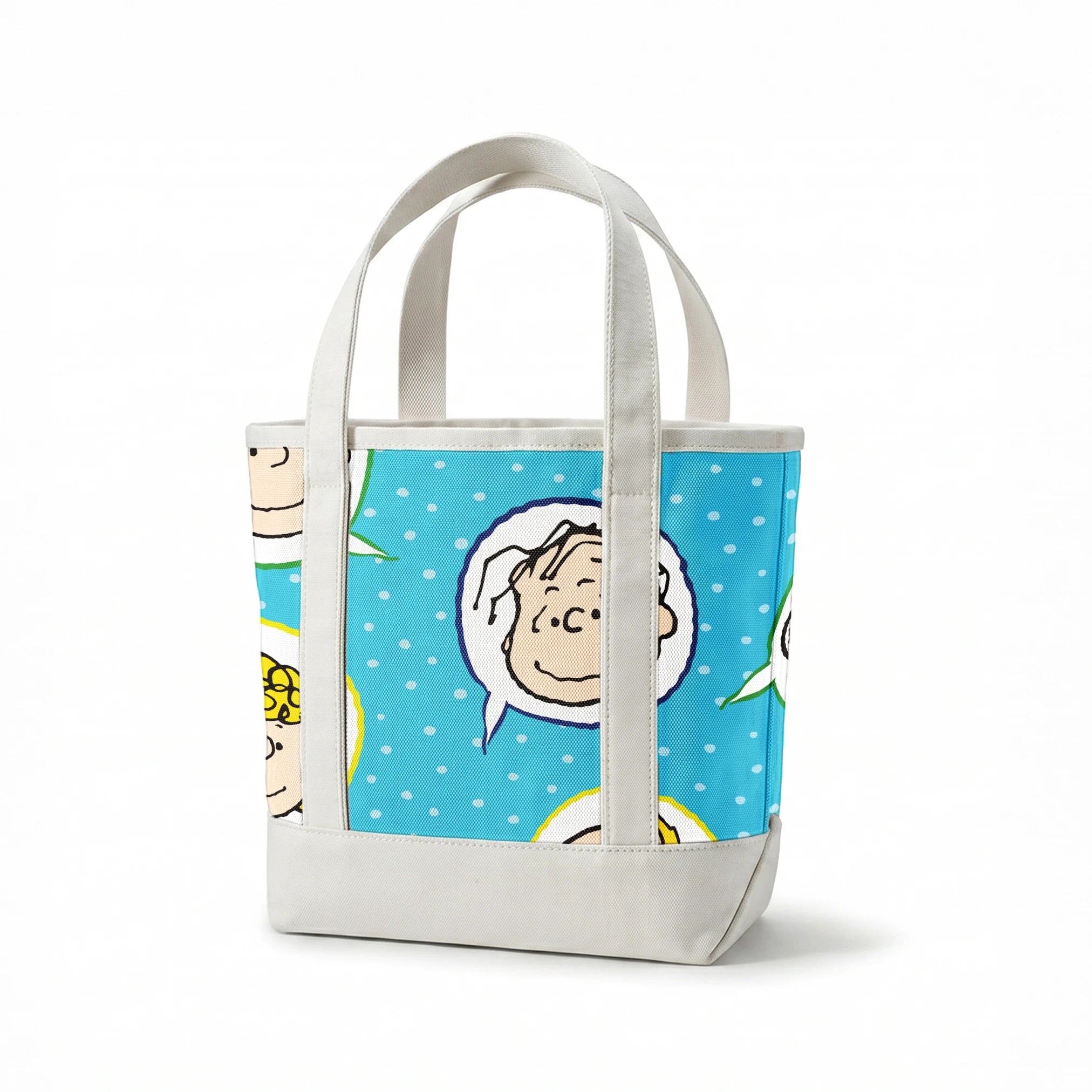 Peanuts characters pattern with Snoopy and other cartoon faces in circles on blue background springs canvastote mockup