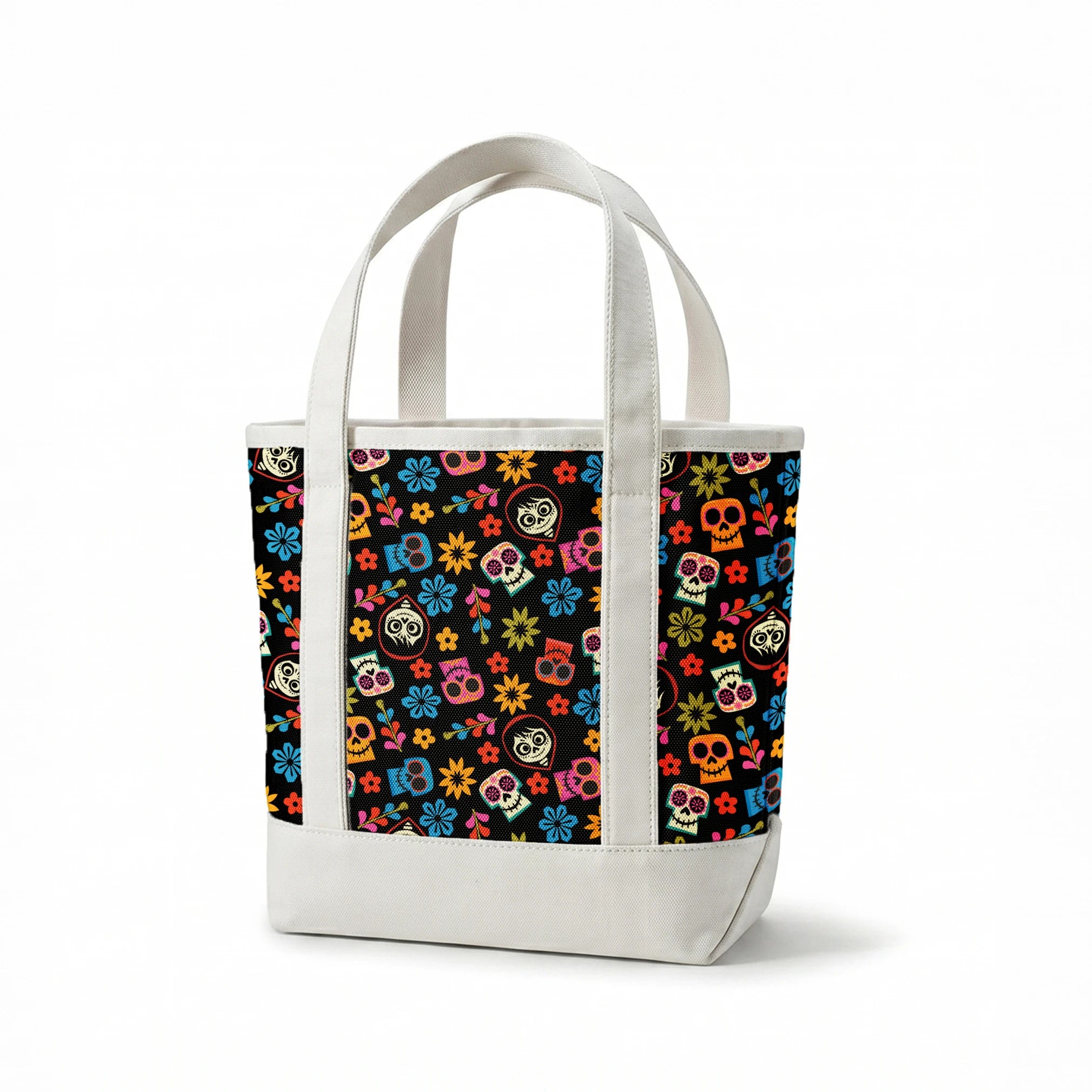 Colorful Coco sugar skull pattern with floral designs on black background for Day of the Dead springs canvastote mockup