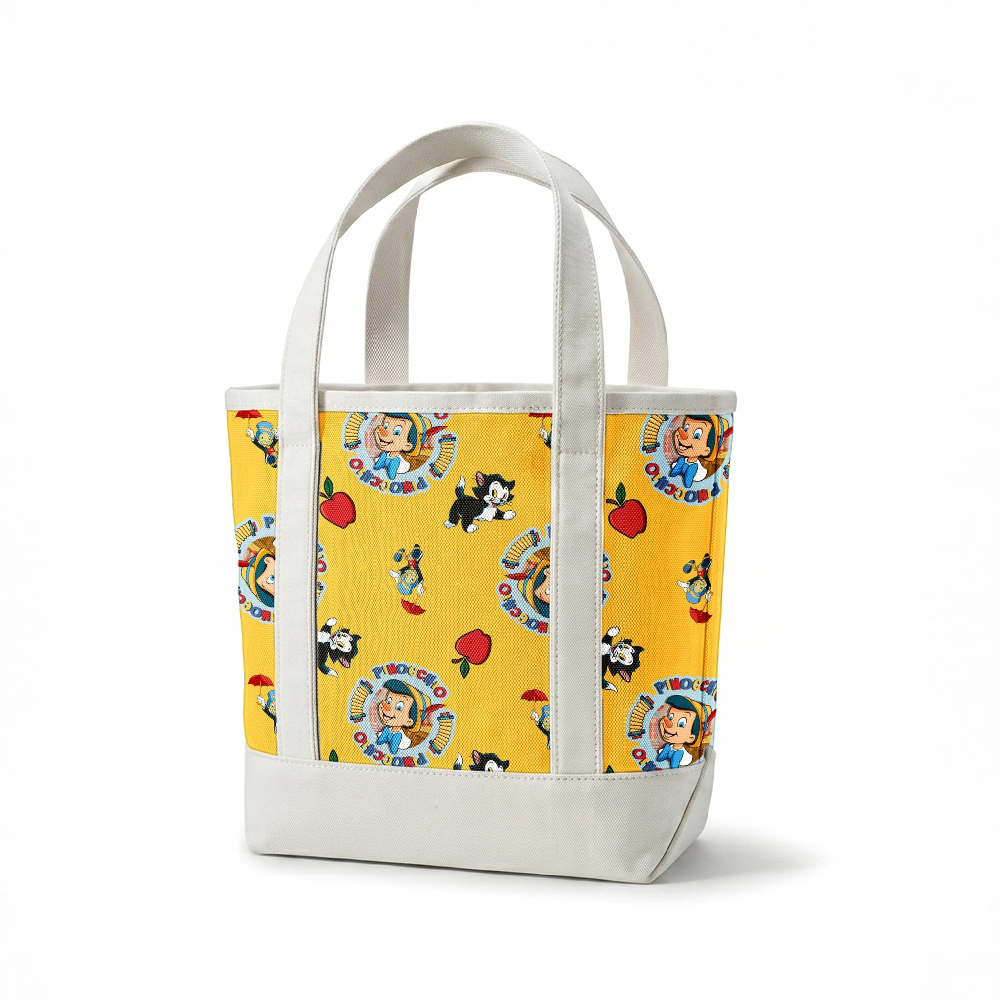 Pinocchio and Disney character pattern on yellow background with circular logos and red apples springs canvastote mockup