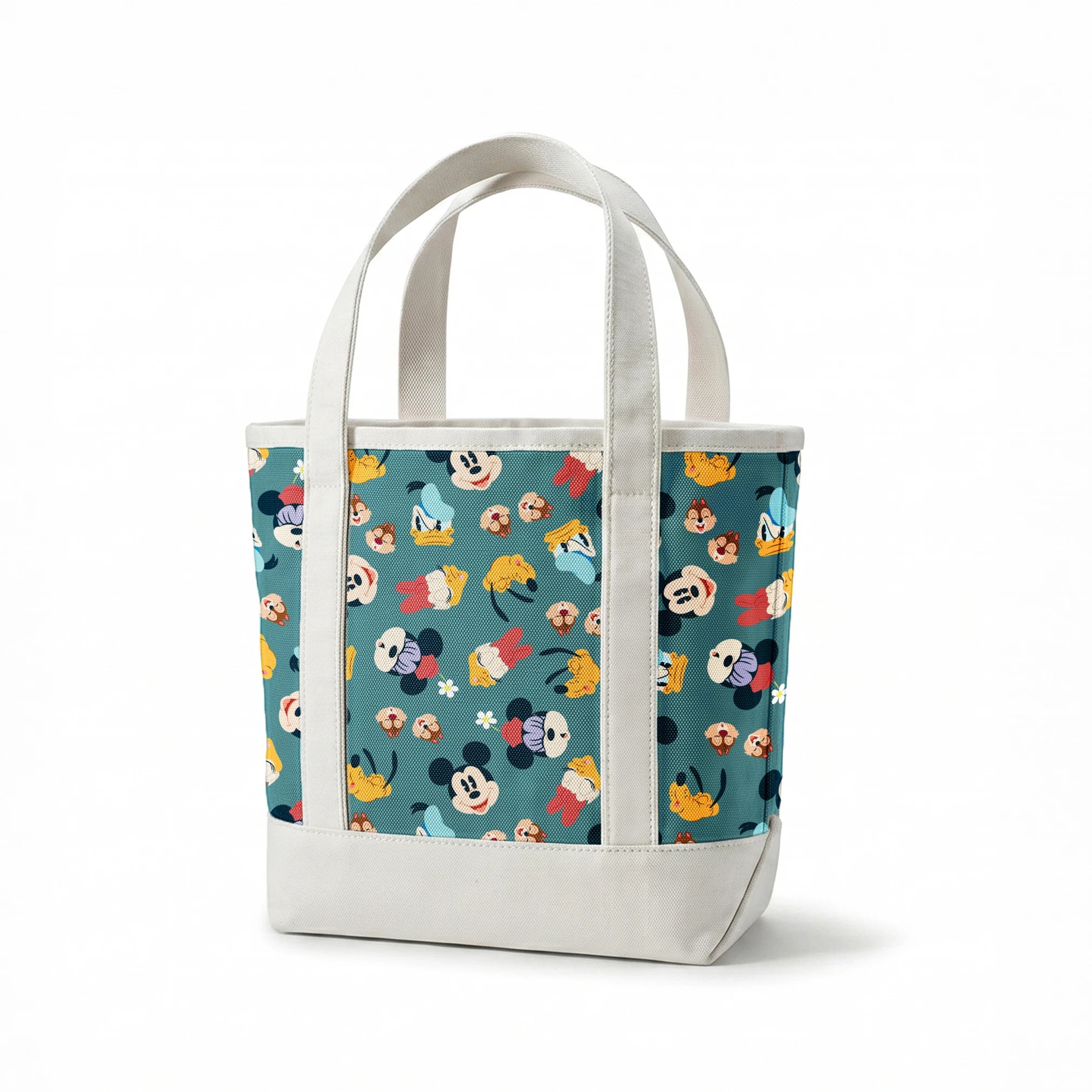 Disney cartoon characters pattern with Mickey Mouse, Donald Duck, and Pluto on teal background with small flowers springs canvastote mockup