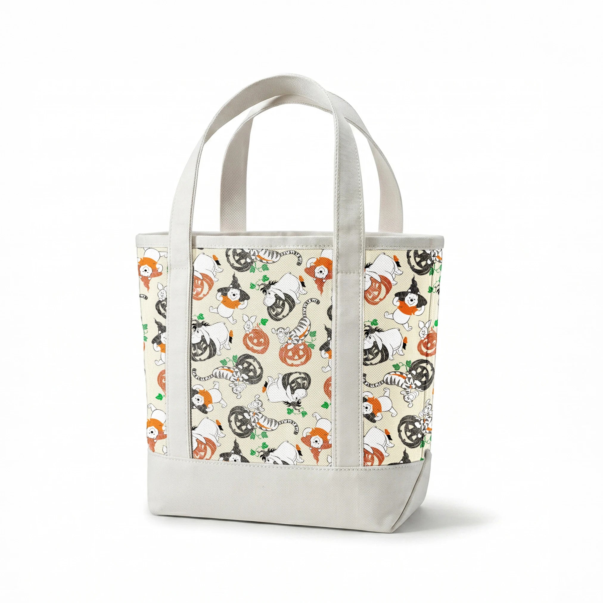 Whimsical Halloween pattern with cartoon ghosts, pumpkins, cats, and bears on cream background springs canvastote mockup