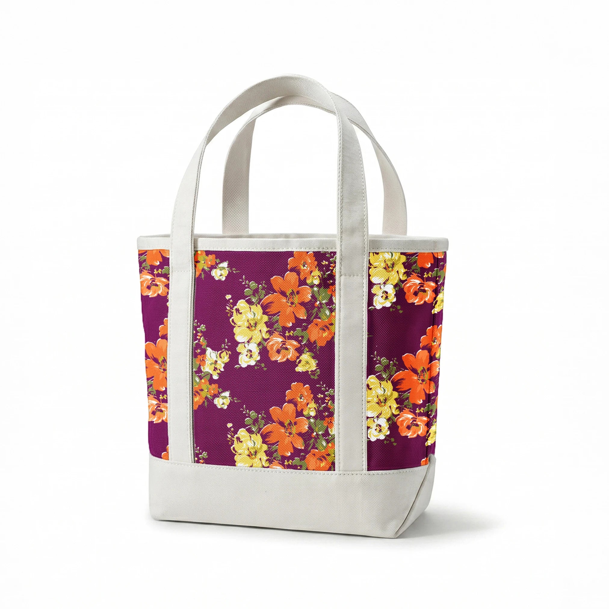 Vibrant floral pattern with orange and yellow blooms against a deep purple background springs canvastote mockup