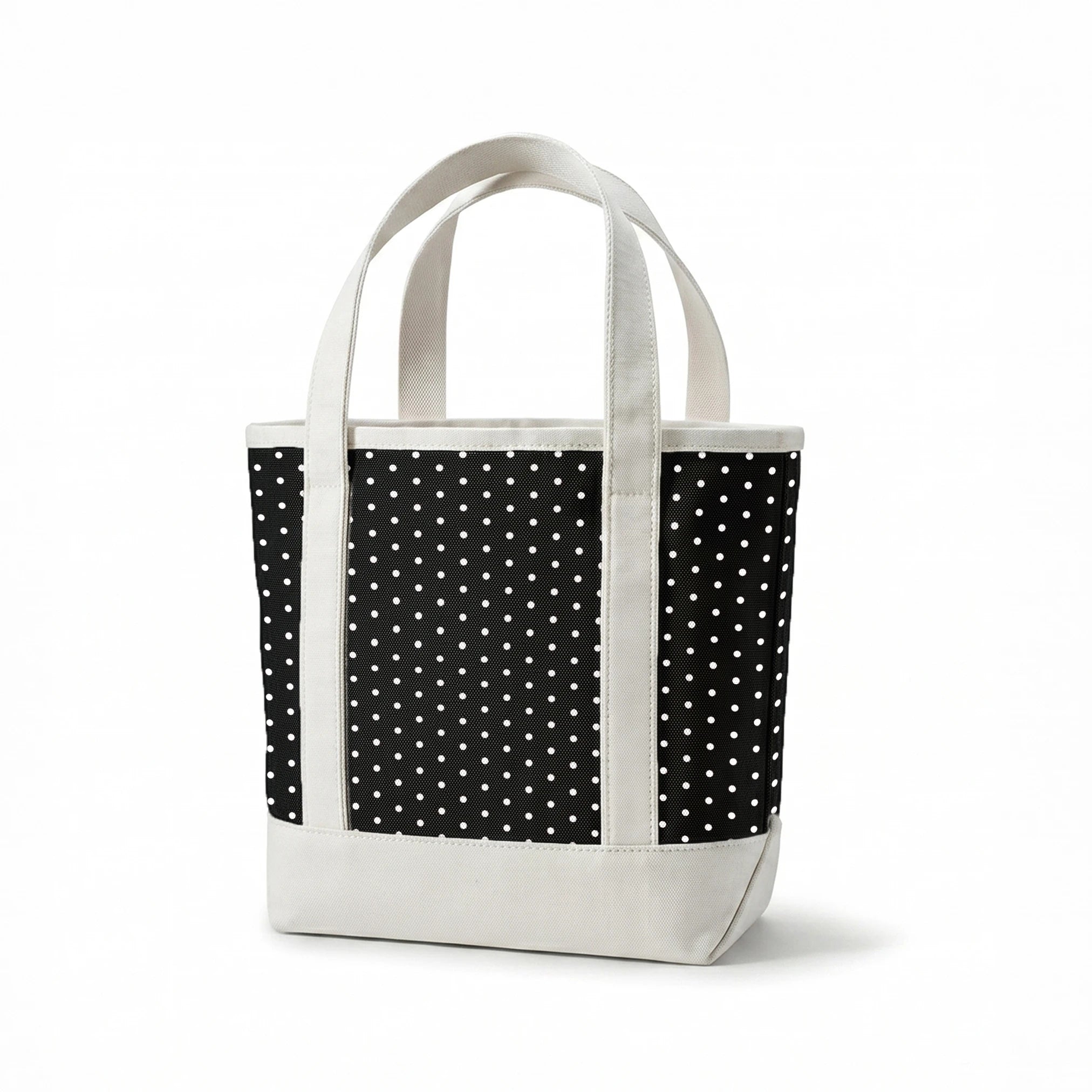 White circular dots on a black background springs canvastote mockup