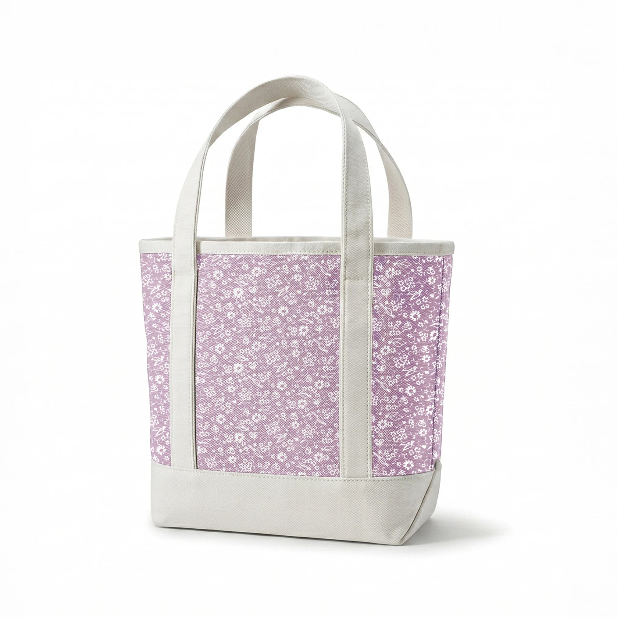 White floral pattern on lavender purple background with daisies and decorative swirls springs canvastote mockup