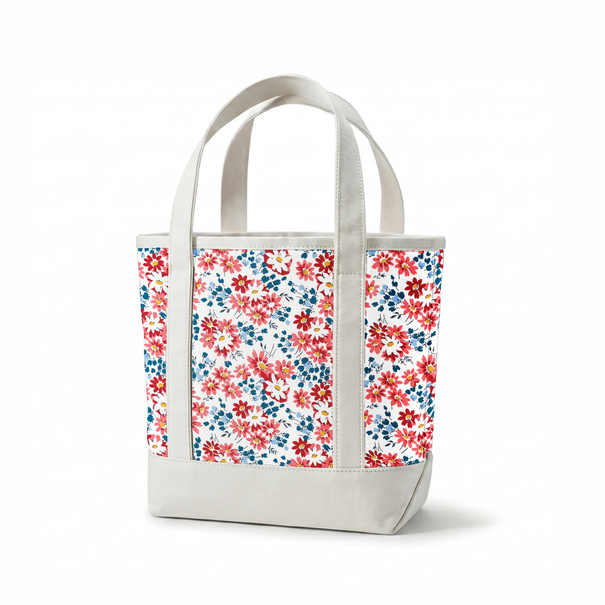 Colorful floral pattern with coral, red, and white daisies with yellow centers and teal leaves springs canvastote mockup