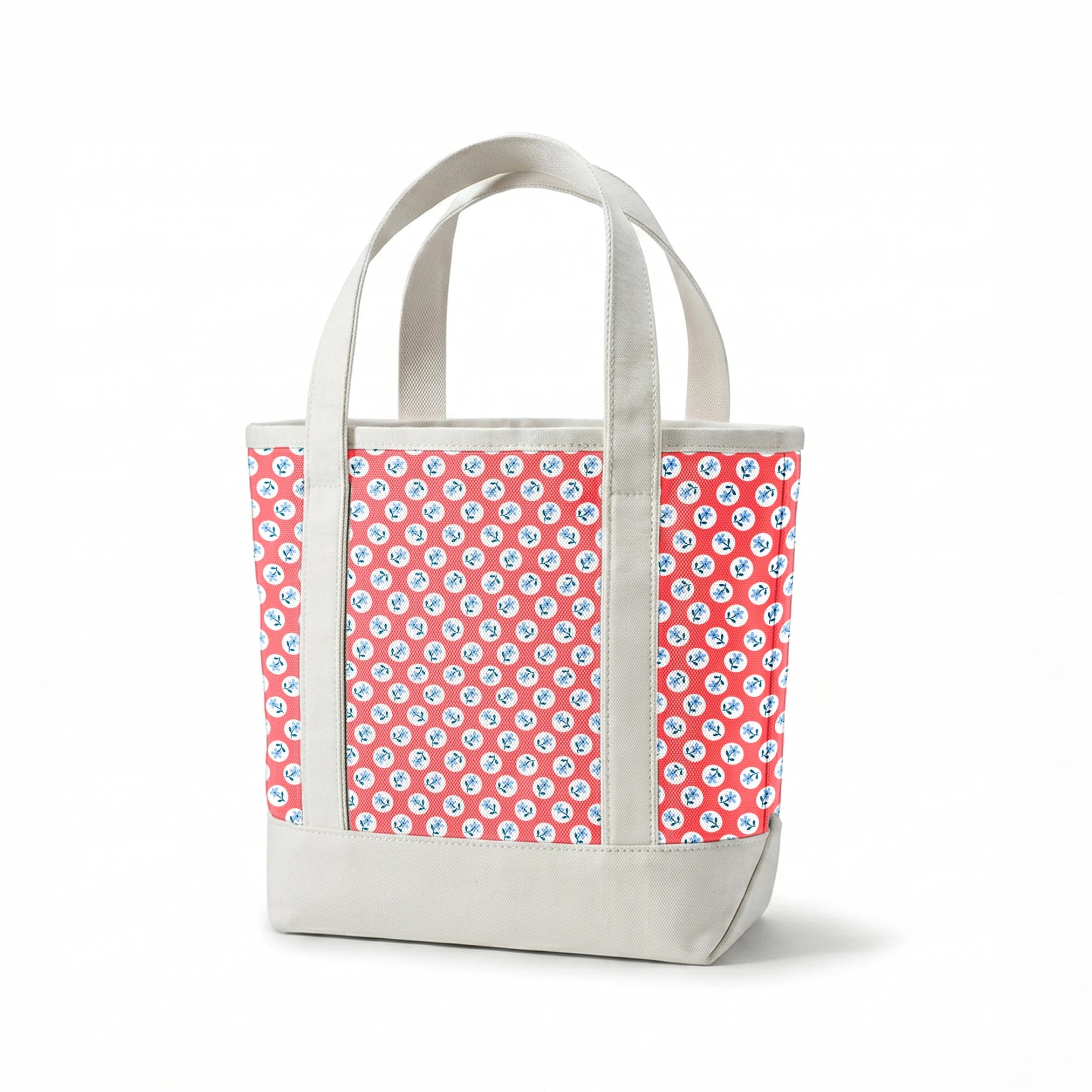 Coral pink background with white circles containing light blue floral designs arranged in a pattern springs canvastote mockup