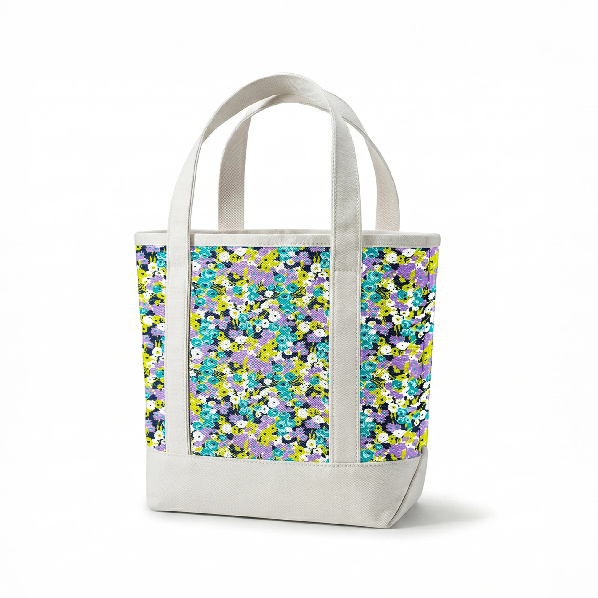 Vibrant floral pattern with turquoise, purple, white, and chartreuse blooms on dark background springs canvastote mockup