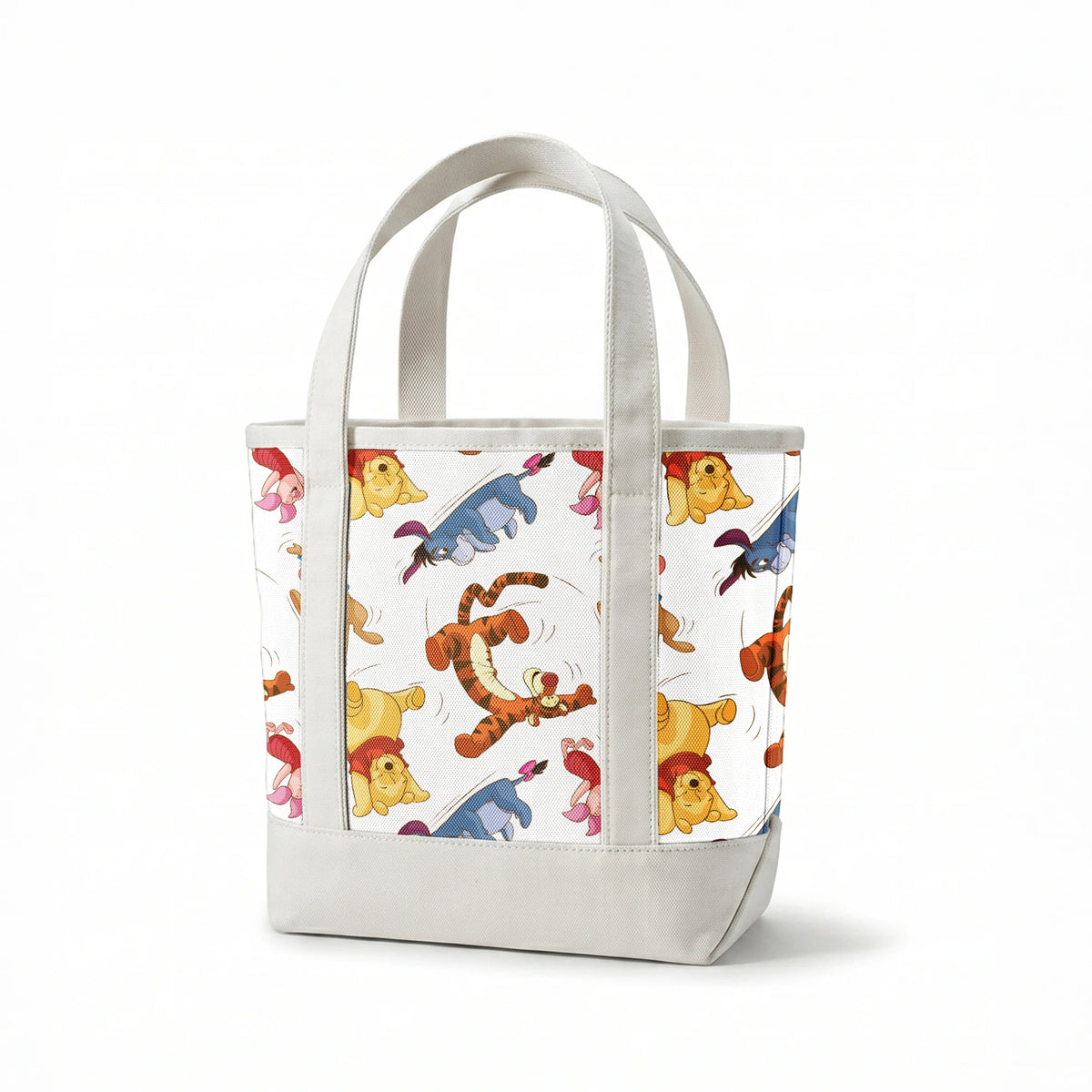 Colorful pattern featuring Winnie the Pooh characters jumping and bouncing on white background springs canvastote mockup