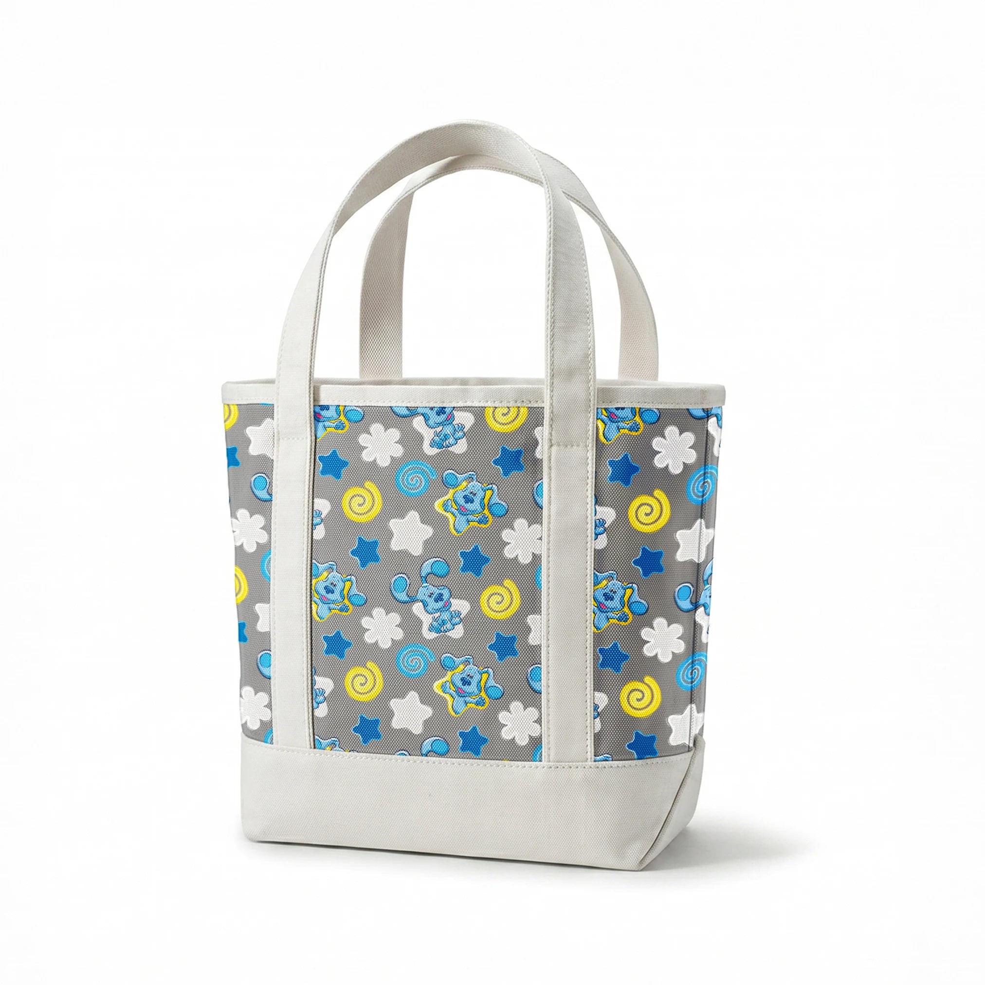 Blue cartoon elephants with stars, swirls, and clouds pattern on gray background springs canvastote mockup