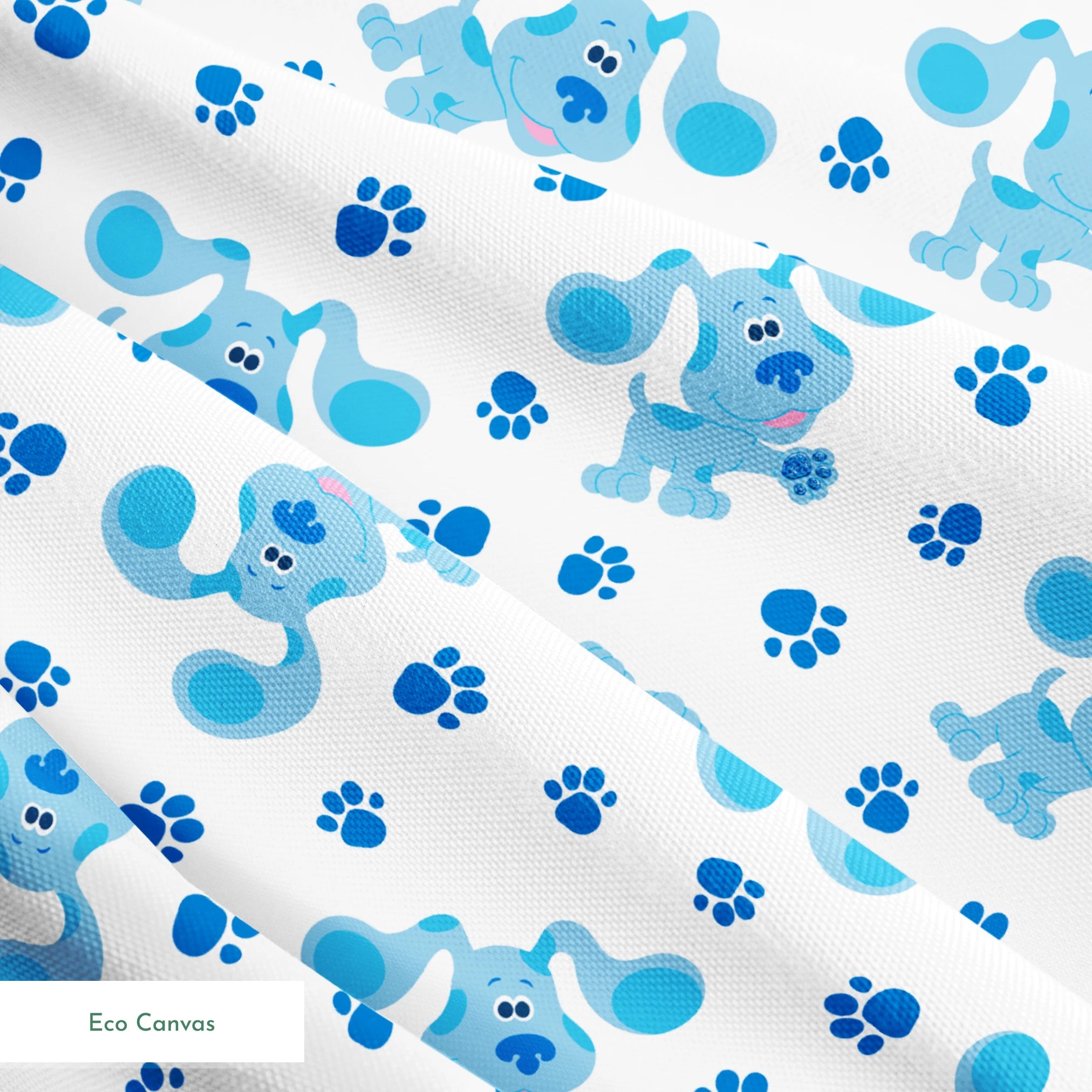 Blue cartoon puppies with floppy ears scattered among paw print pattern on white background springs ecocanvas texture