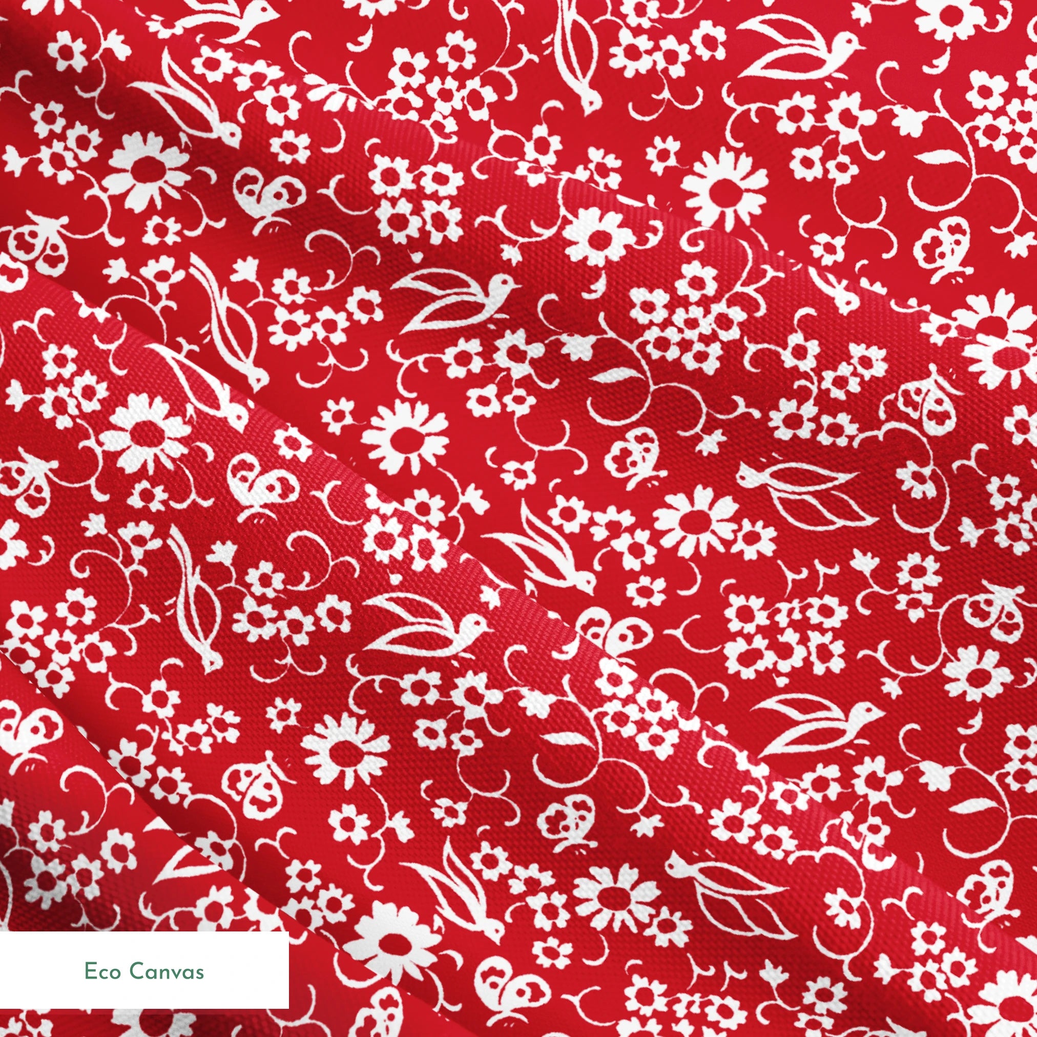 White floral and bird silhouette pattern on a bright red background. springs ecocanvas texture