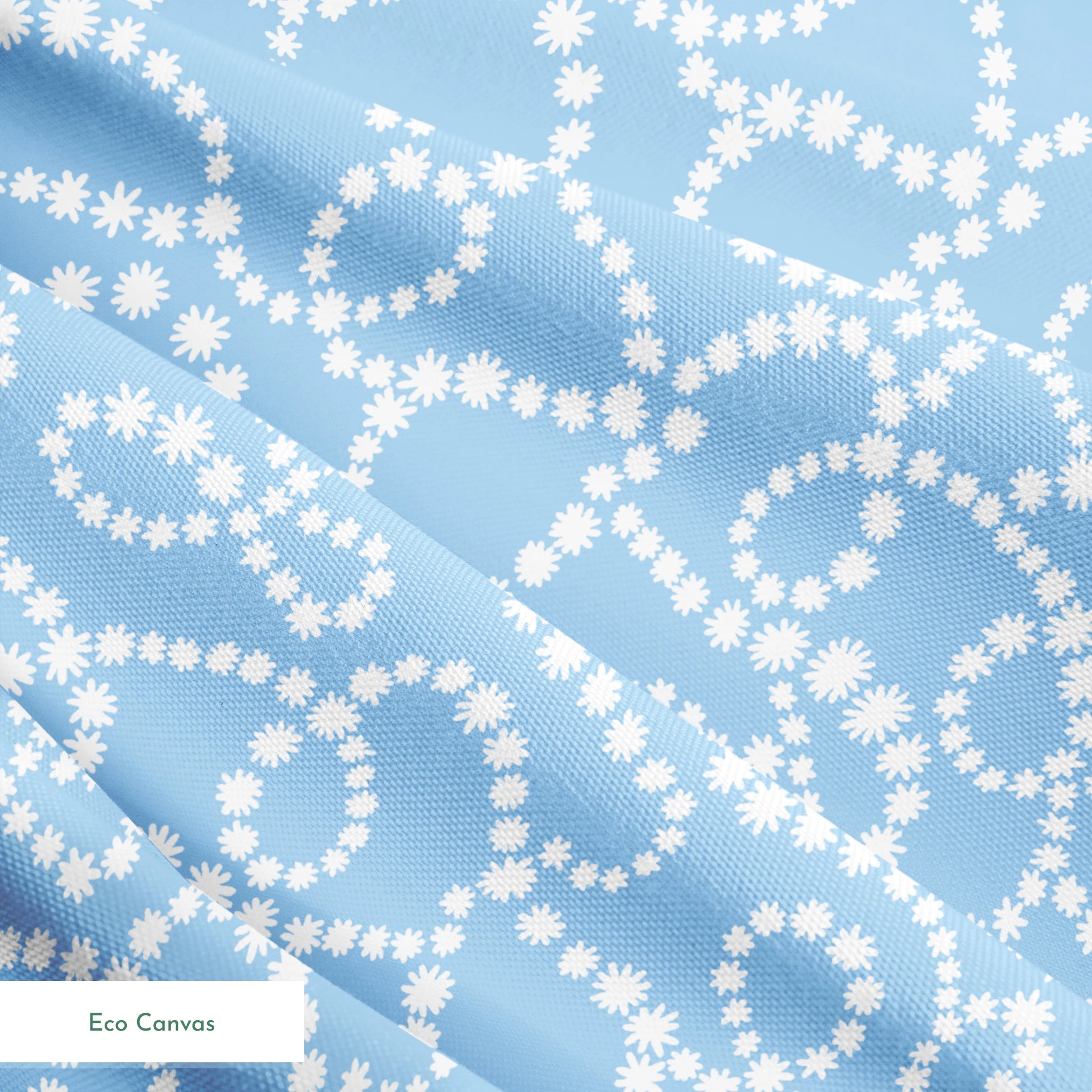 Pale blue background with white dotted swirling pattern resembling strings of pearls or bubbles in abstract curves springs ecocanvas texture