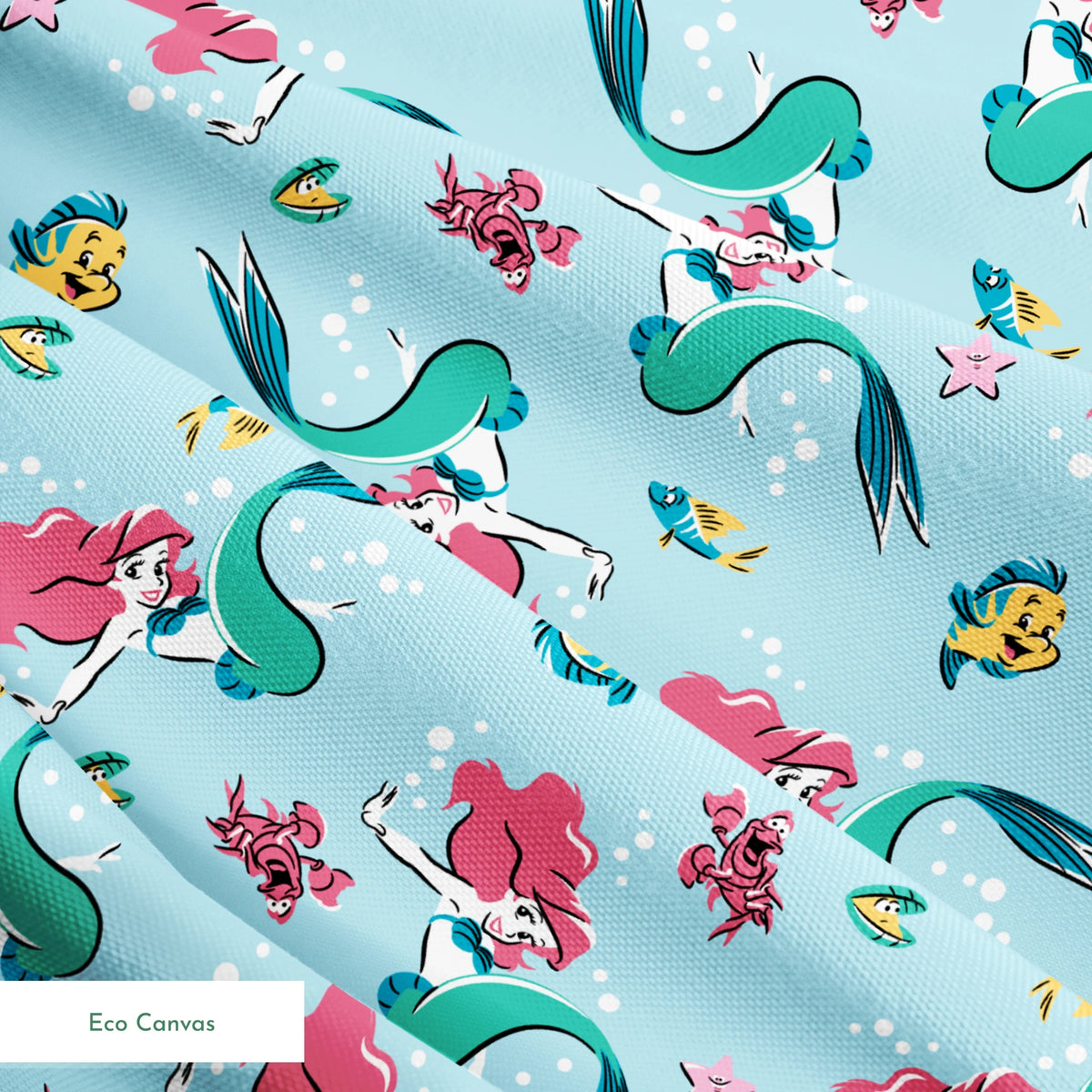 Underwater pattern with colorful mermaids, tropical fish, crabs, and starfish on light blue background springs ecocanvas texture