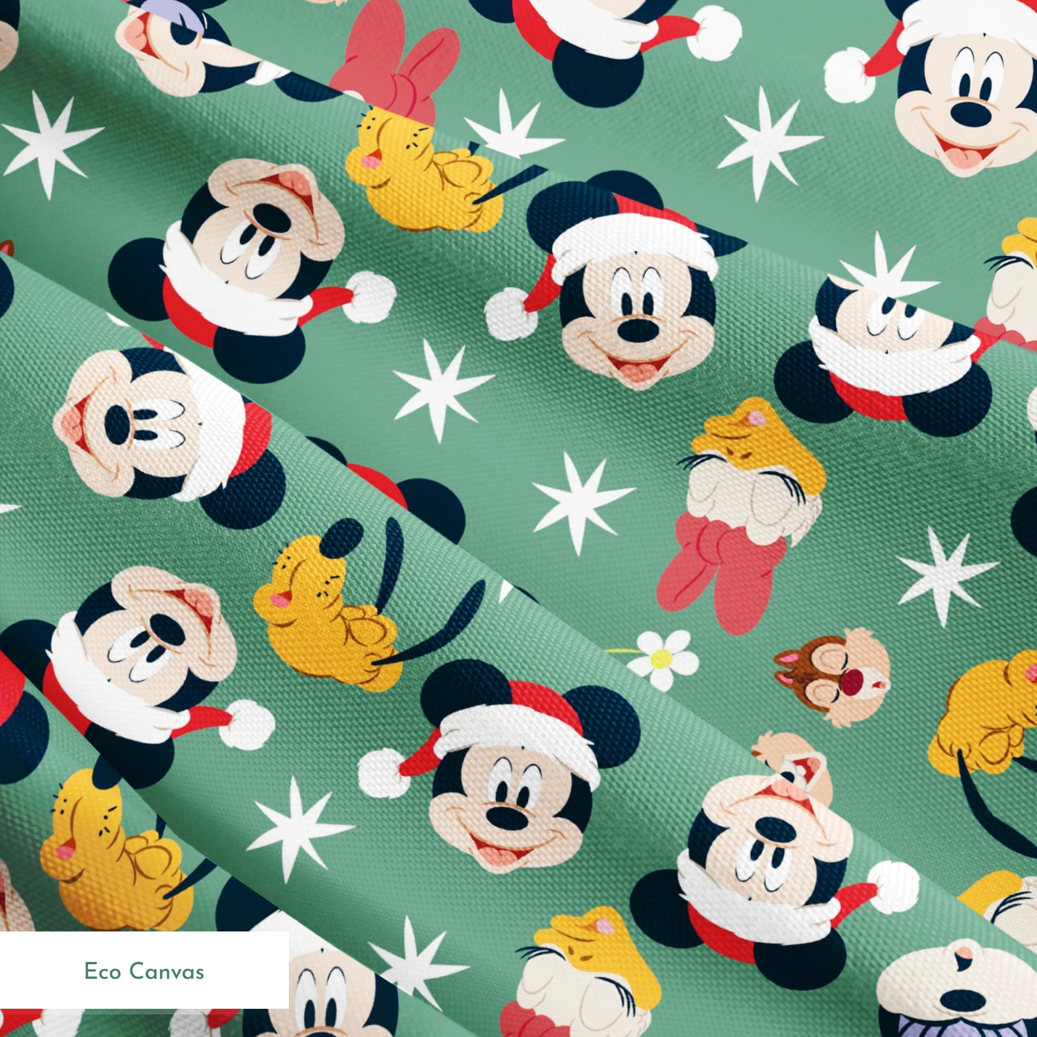 Mickey Mouse holiday pattern with characters wearing Santa hats on green background with stars and ornaments springs ecocanvas texture