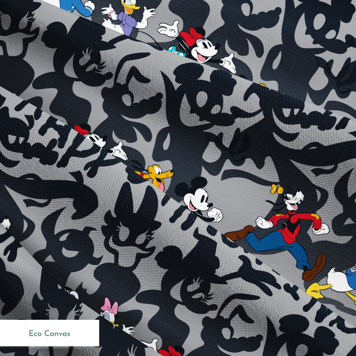 Classic Disney characters on dark gray background with "Happy Haunting" text, Mickey, Donald, and friends in Halloween-themed poses. springs ecocanvas texture
