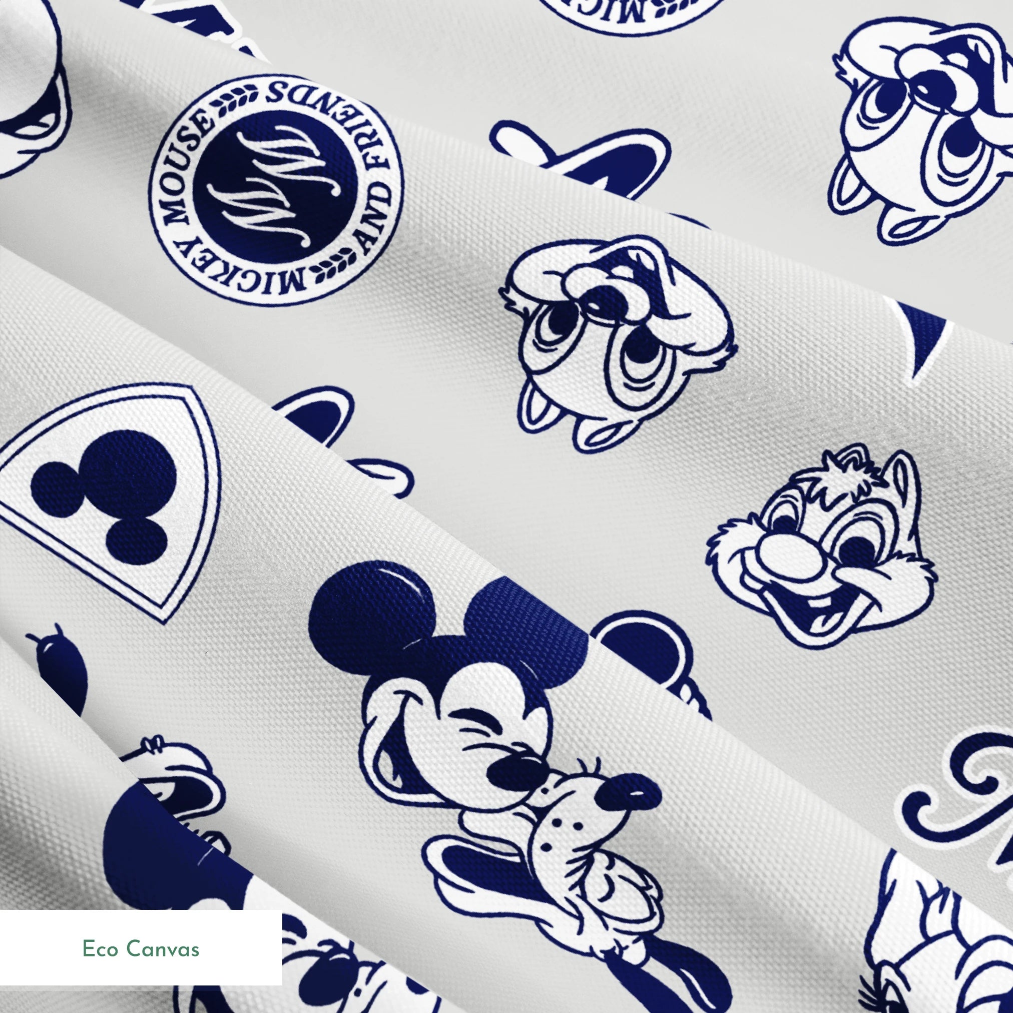 Disney character pattern with Mickey Mouse, Donald Duck and other classic cartoon figures in navy blue on light background. springs ecocanvas texture