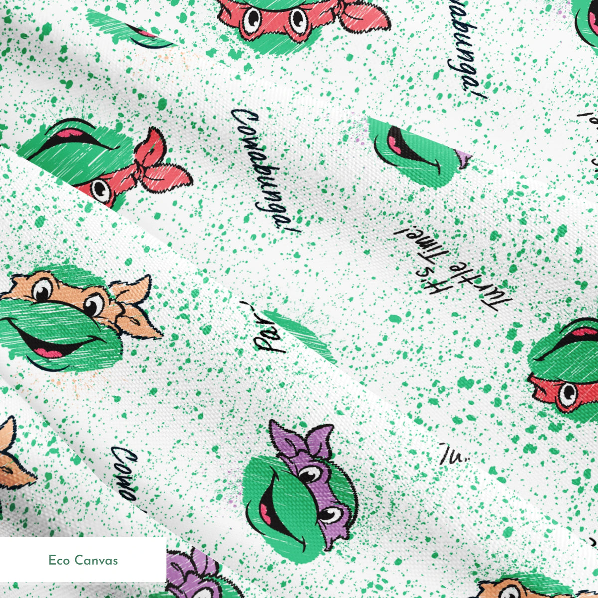 Pattern of Teenage Mutant Ninja Turtles with colorful masks on speckled green background with phrases like "Turtle Power! springs ecocanvas texture