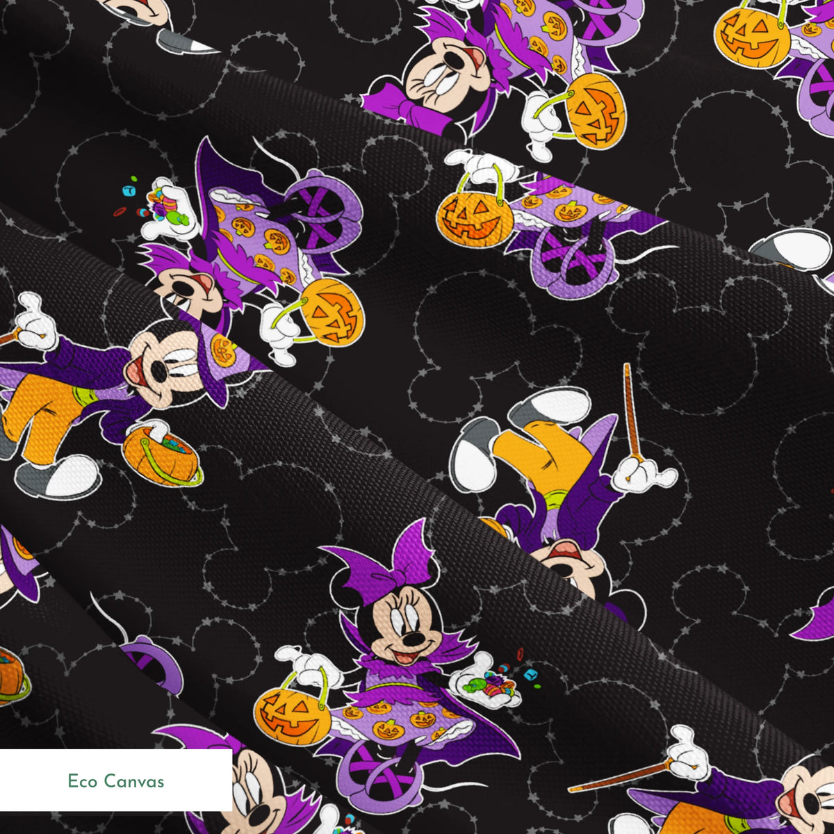 Mickey and Minnie in Halloween costumes on black background with purple, orange, and white details in a scattered pattern springs ecocanvas texture