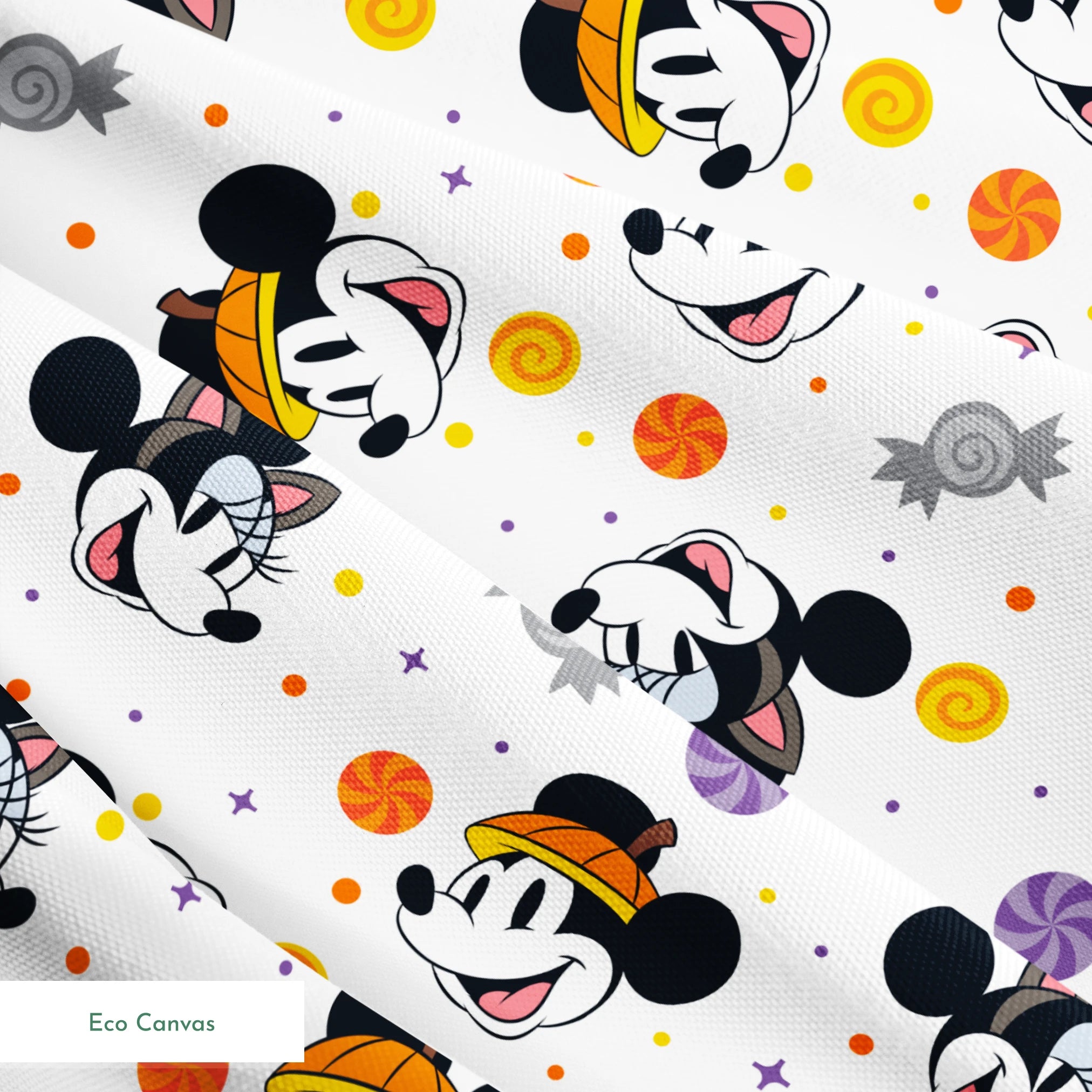Mickey and Minnie Mouse cartoon heads scattered with wrapped candies and colorful dots on white background springs ecocanvas texture