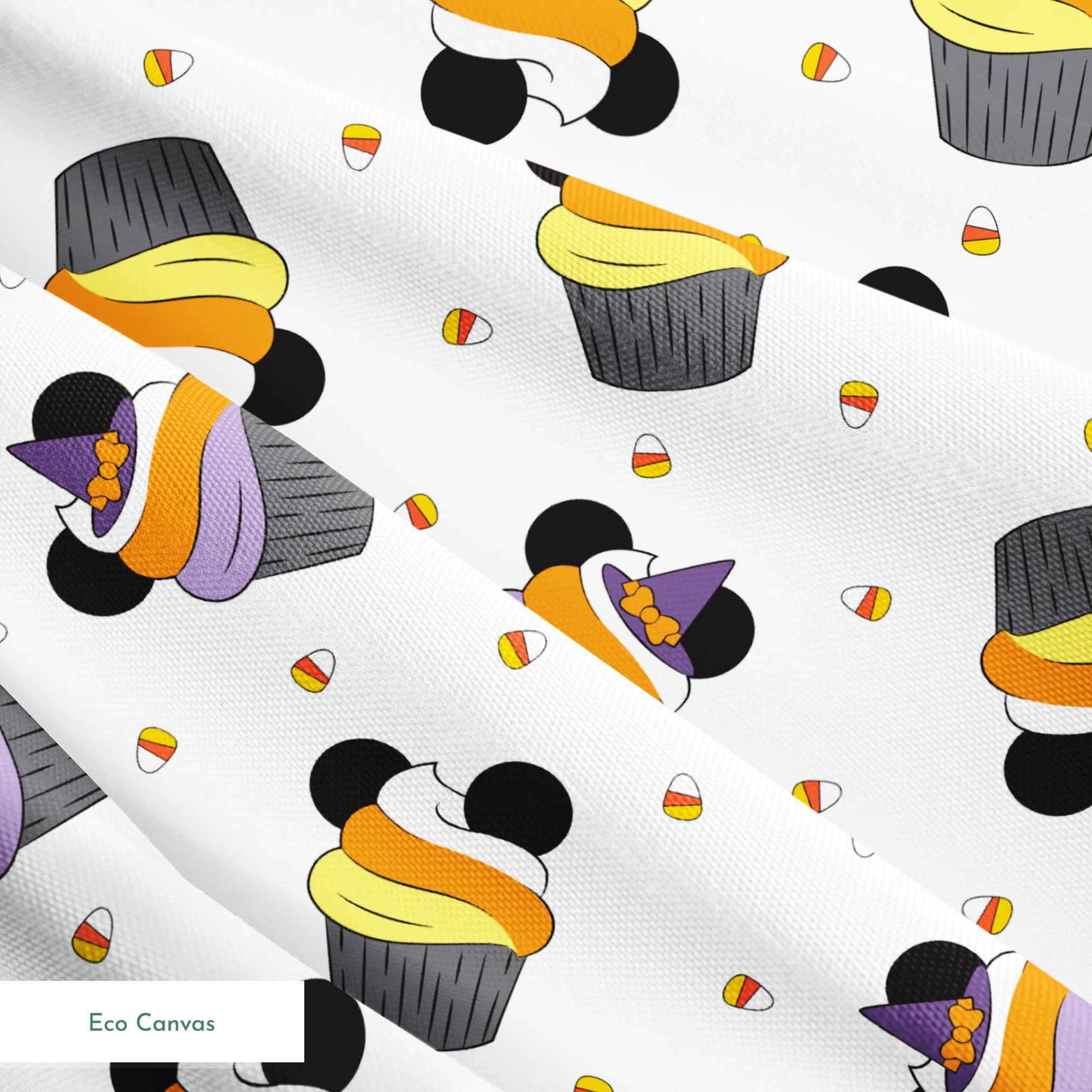 Disney cupcakes with black circular elements and colorful frosting in orange, yellow, and purple on a white background. springs ecocanvas texture