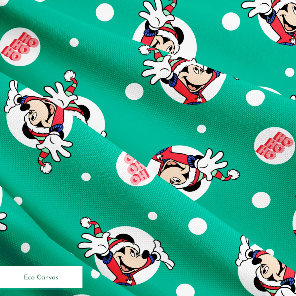Mickey Mouse in Santa hats on green polka dot background with "Ho Ho Ho" text springs ecocanvas texture