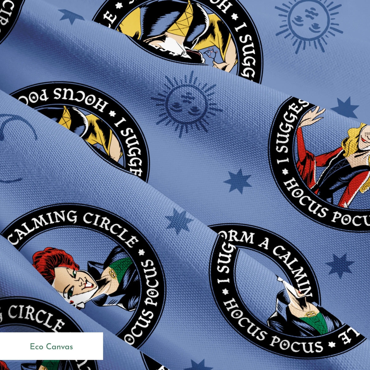 Cartoon witches in circular emblems with "Hocus Pocus" text on blue background with stars springs ecocanvas texture