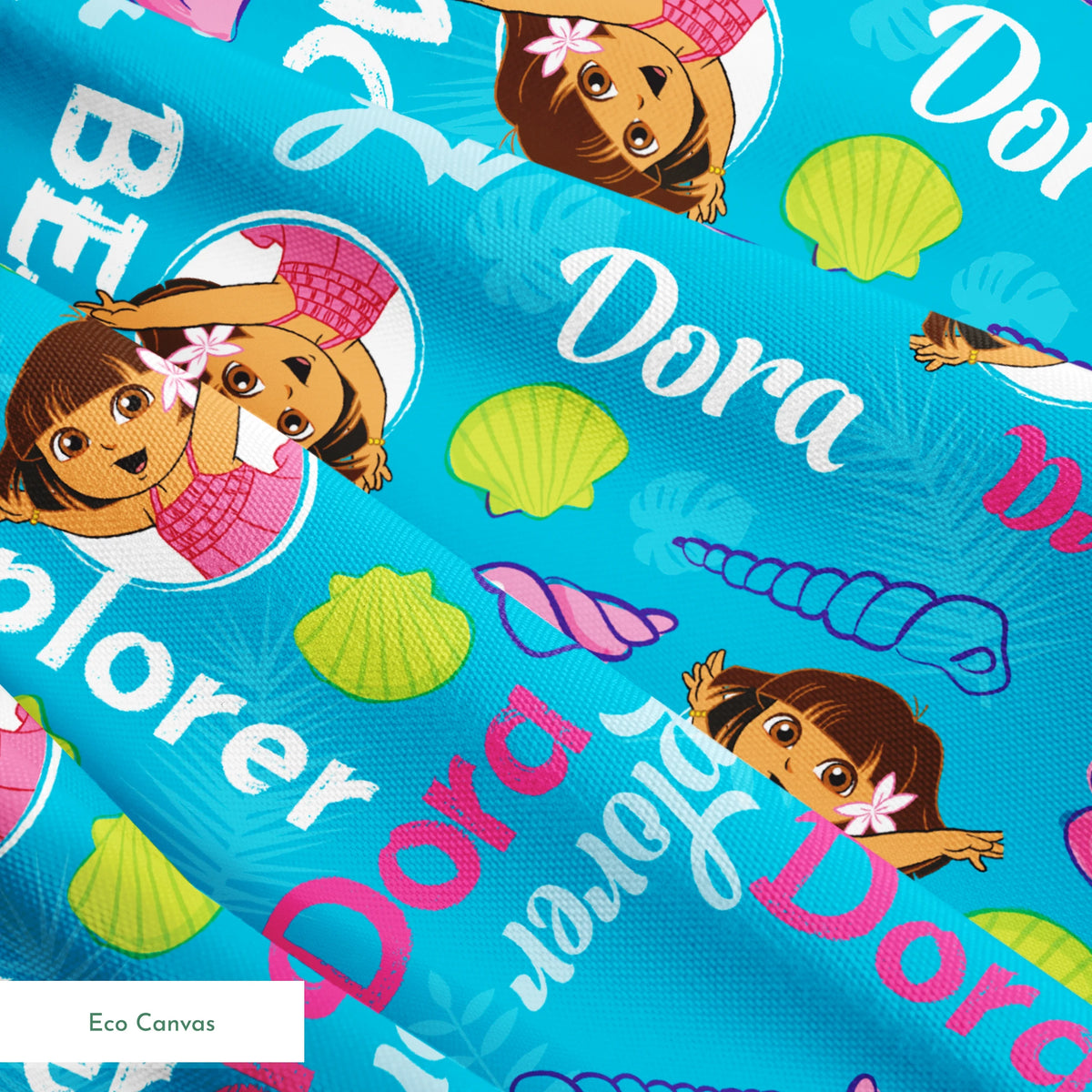 Bright blue pattern featuring Dora the Explorer cartoon character with seashells and "Beach Explorer" text springs ecocanvas texture