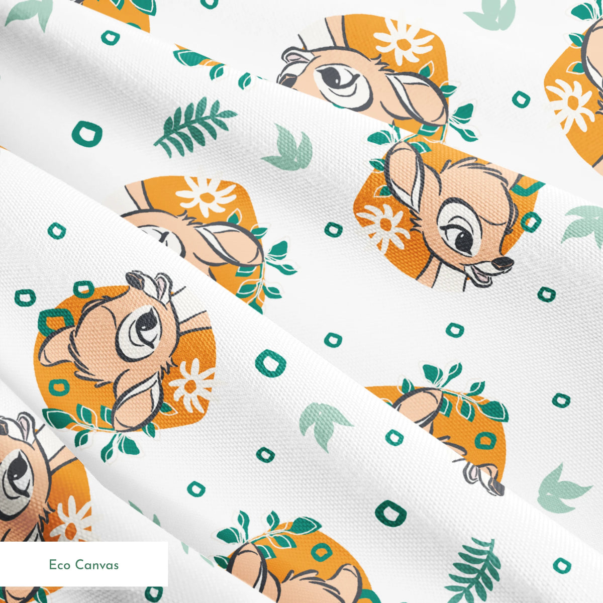 Disney’s Bambi illustrated in golden-orange floral medallions with green leaves and scattered geometric accents on a white background. springs ecocanvas texture