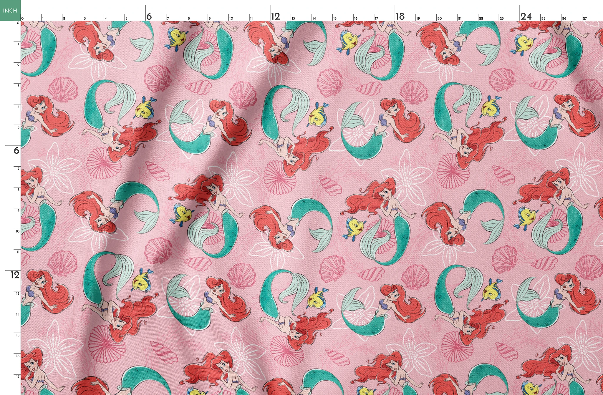 Illustrated pattern of mermaids with red hair and green tails swimming with yellow fish on pink seashell background springs fatquarter mockup