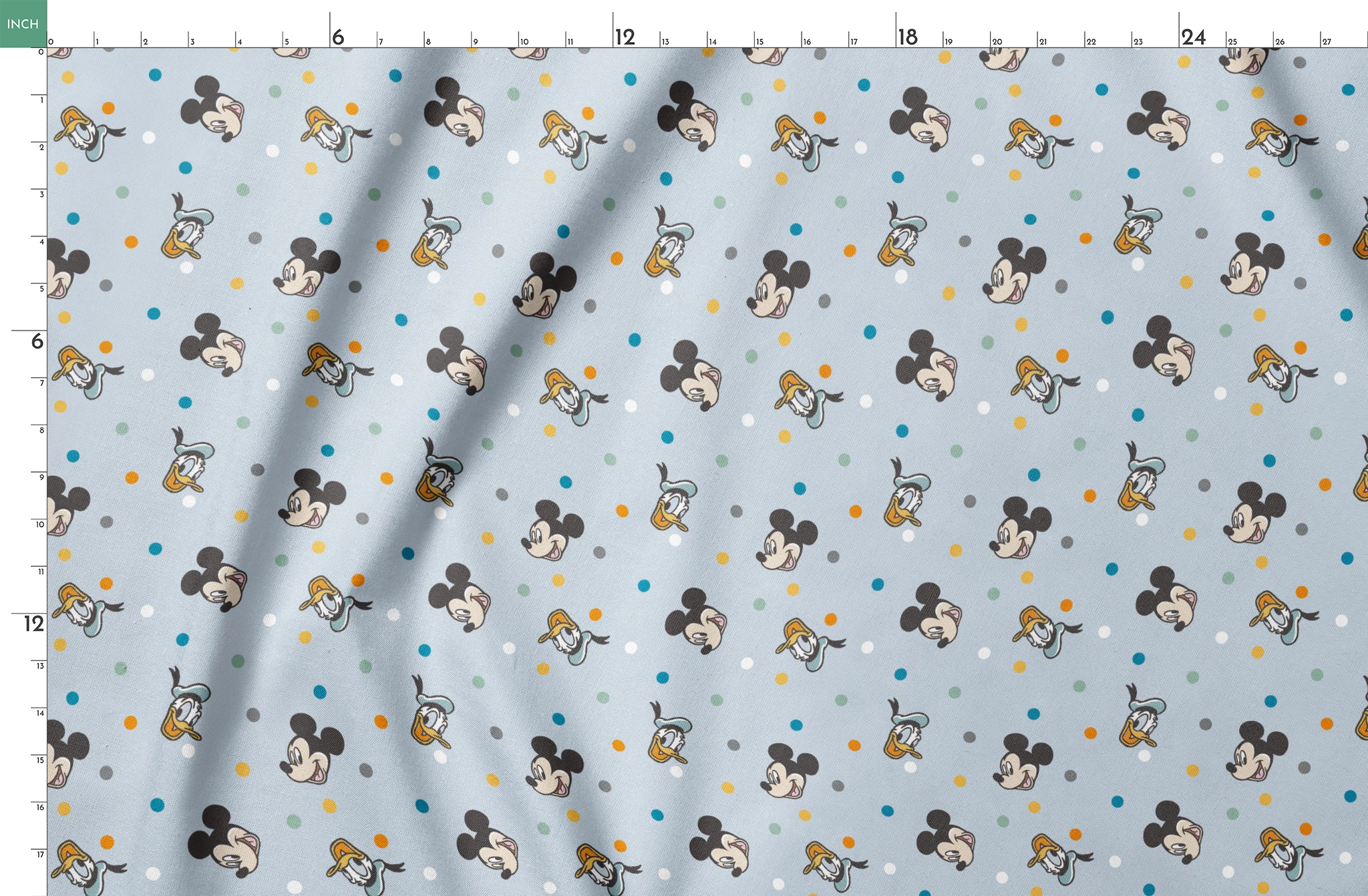 Disney character pattern with Mickey Mouse and Donald Duck heads scattered on light blue background with colorful polka dots springs fatquarter mockup