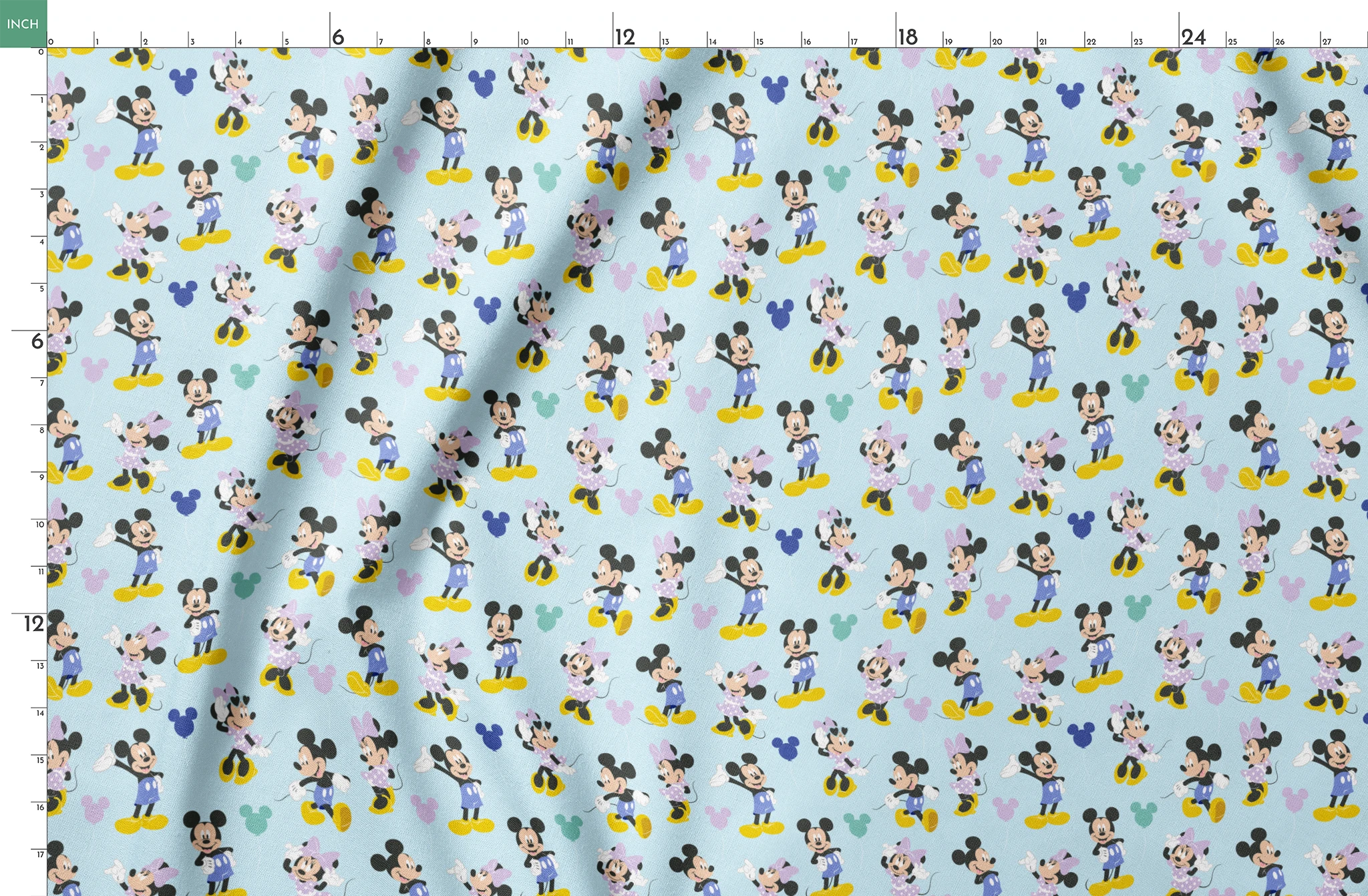 Pattern of Mickey and Minnie Mouse characters in various poses on light blue background springs fatquarter mockup
