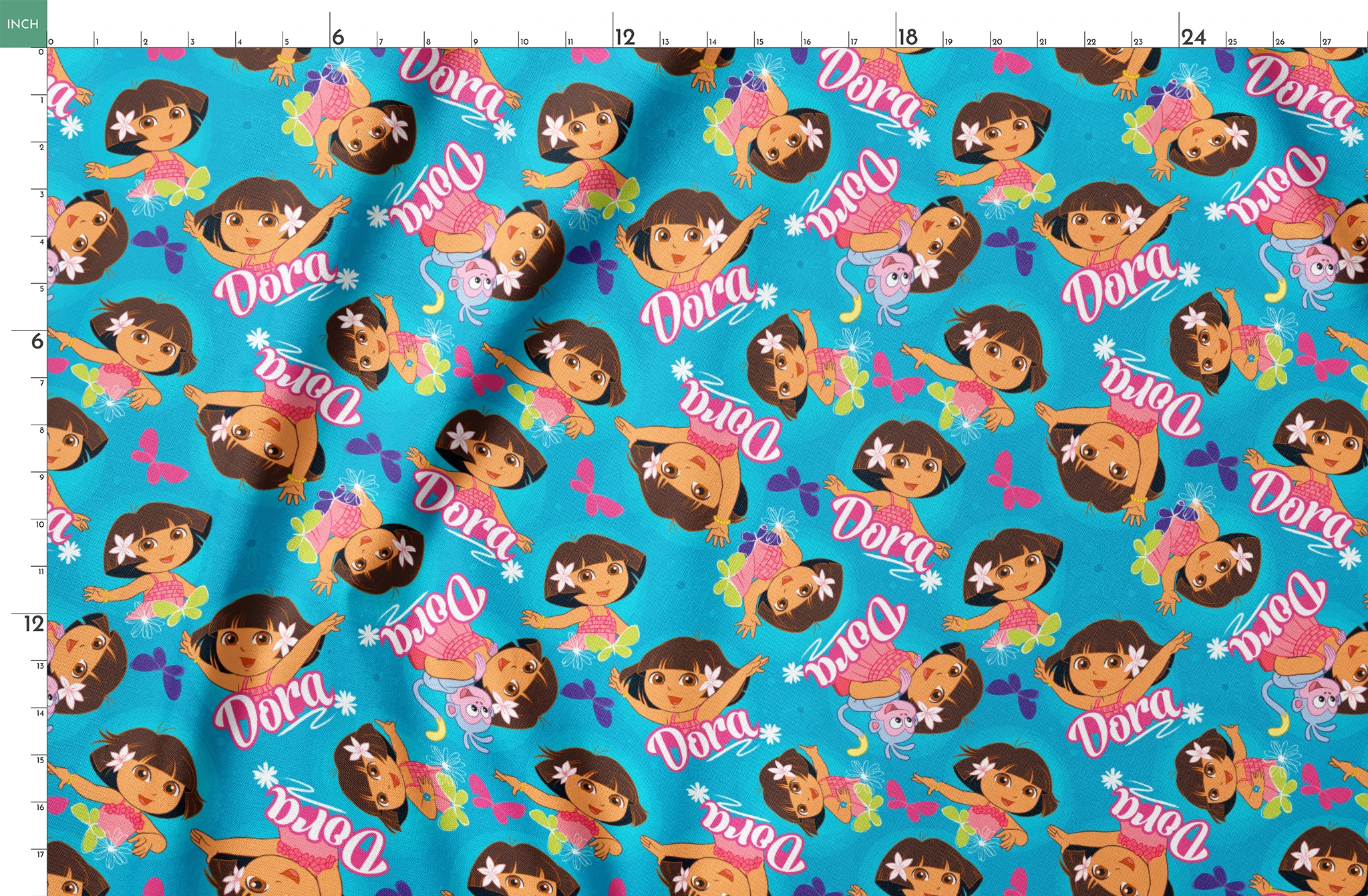 Bright blue pattern with cartoon character Dora, flowers, and "Dora" text repeated throughout springs fatquarter mockup
