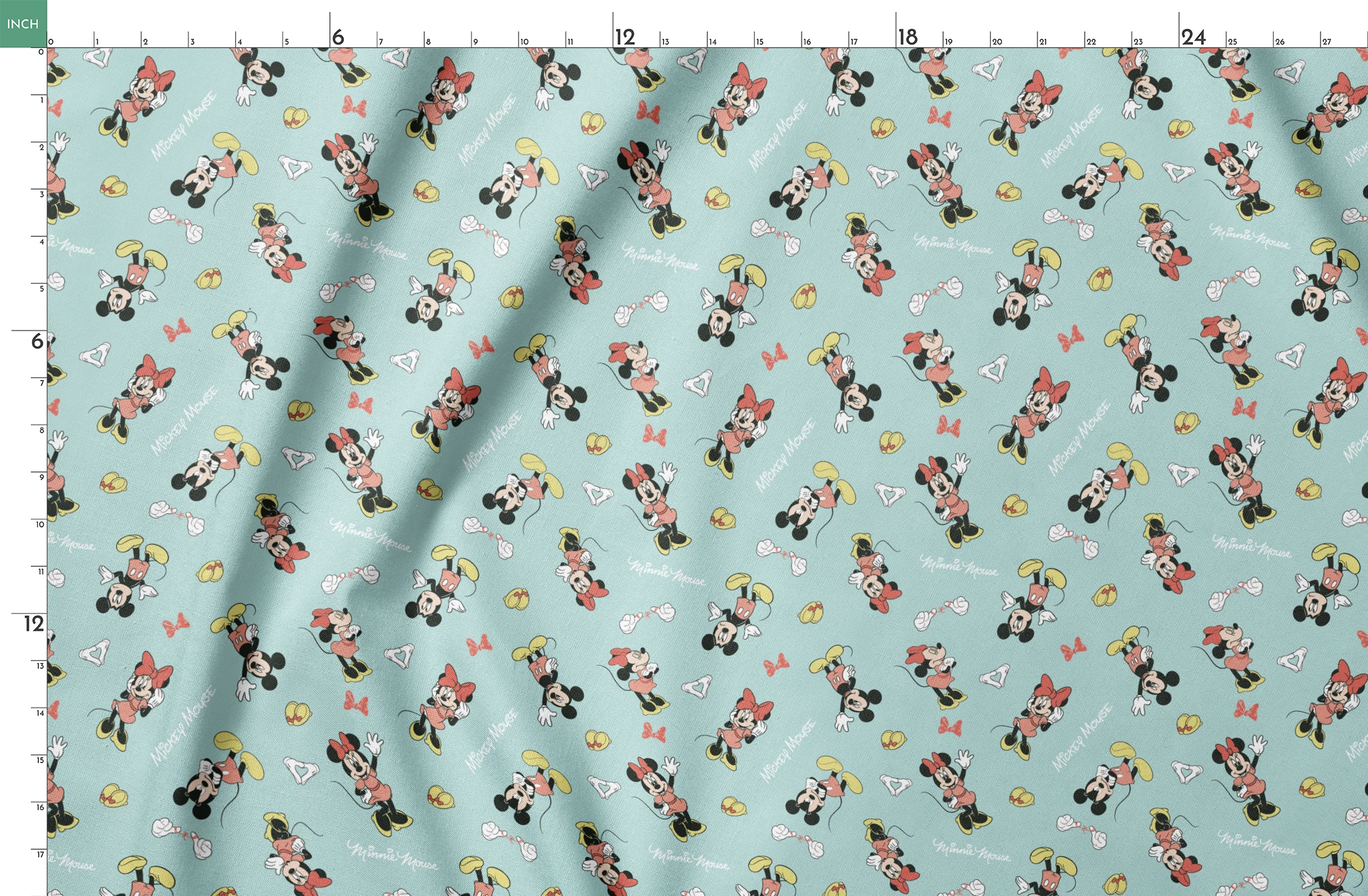 Mickey and Minnie Mouse pattern on light turquoise background with scattered characters, bows, and gloves springs fatquarter mockup