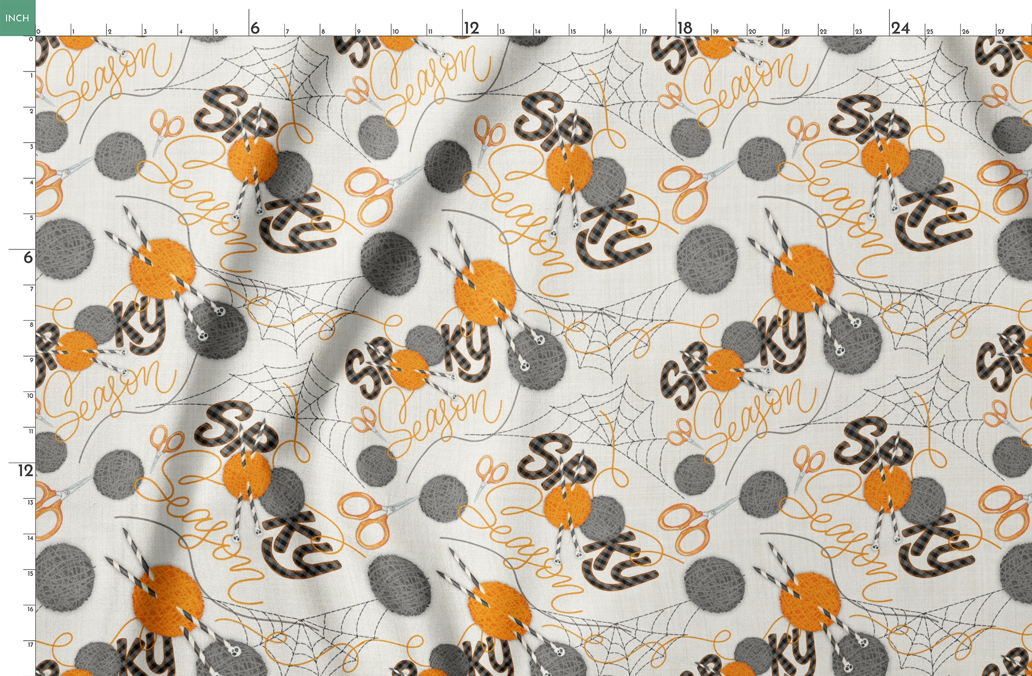 Halloween design by Nicole Tamarin featuring orange and gray yarn balls, scissors, spiderwebs, and “Spooky Season” lettering on a cream background. springs fatquarter mockup