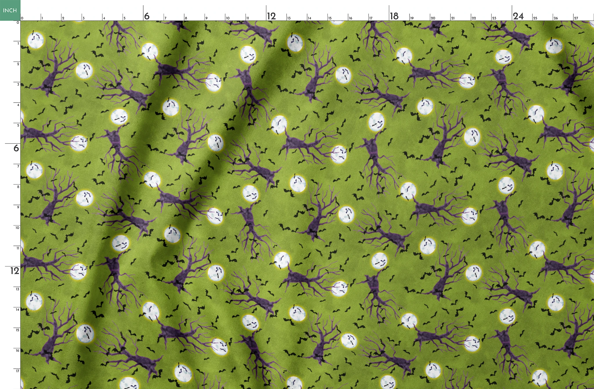 Halloween fabric design with purple haunted trees, bats, and glowing moons on a green background, illustrated by Nicole Tamarin. springs fatquarter mockup