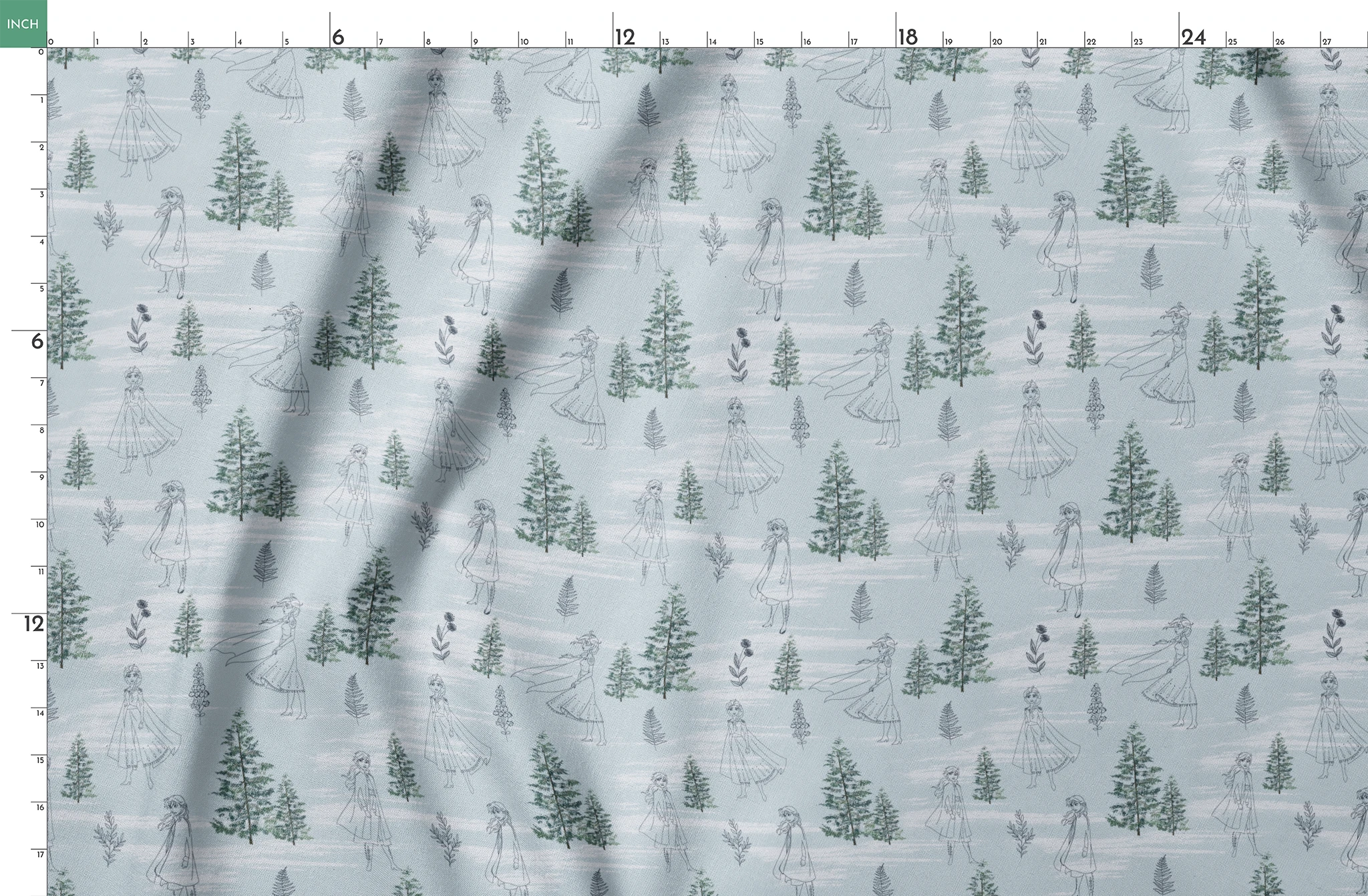 Pale blue pattern with delicate line drawings of pine trees, Elsa, and Anna across a wintry landscape springs fatquarter mockup