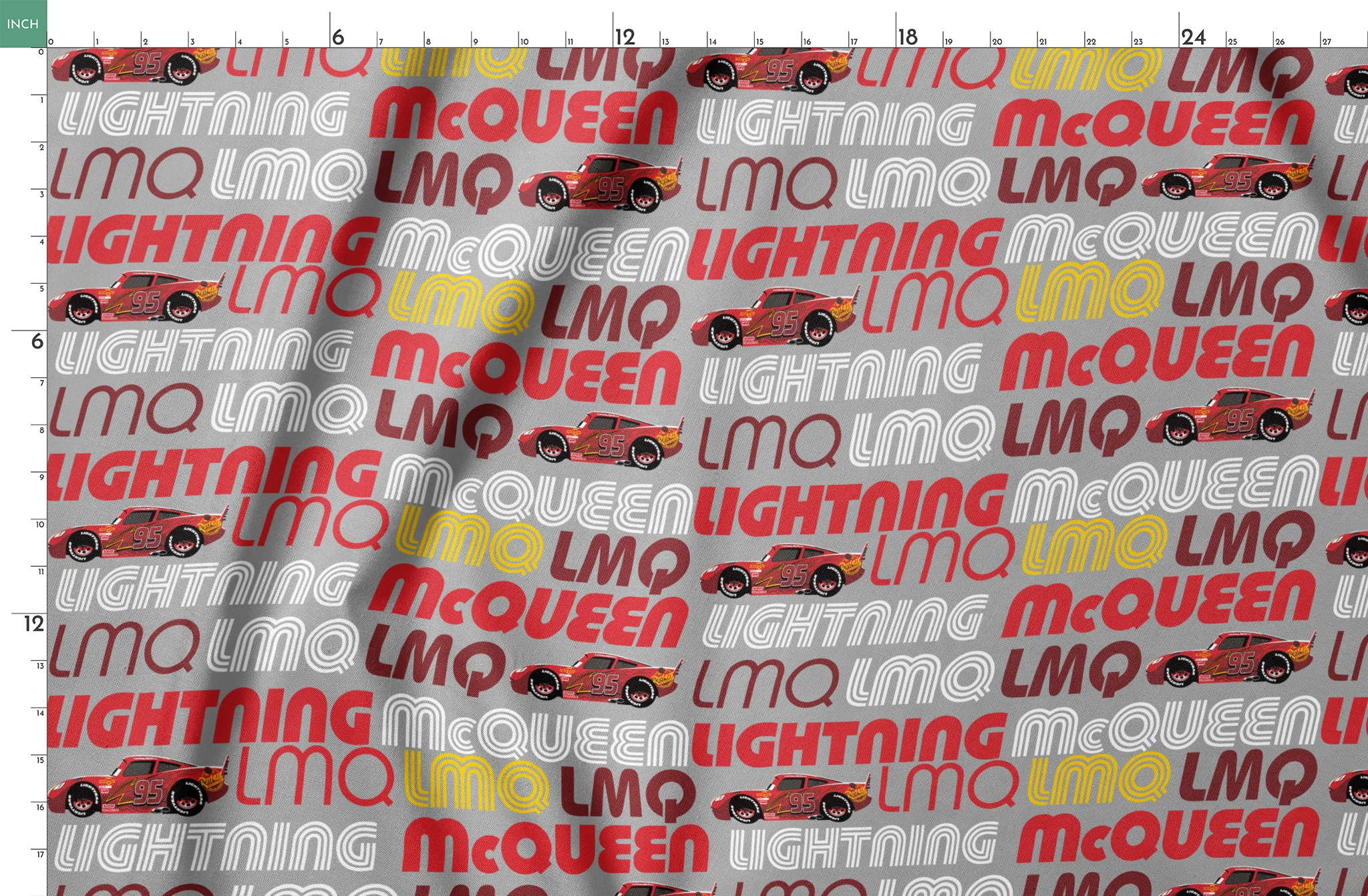 Lightning McQueen race car graphic with repeating LMQ text in red, yellow, and white on gray background springs fatquarter mockup