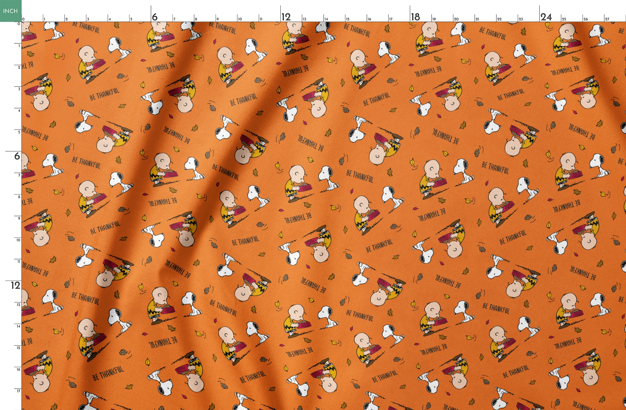 Peanuts characters on orange background with autumn leaves and "Be Thankful" text pattern springs fatquarter mockup