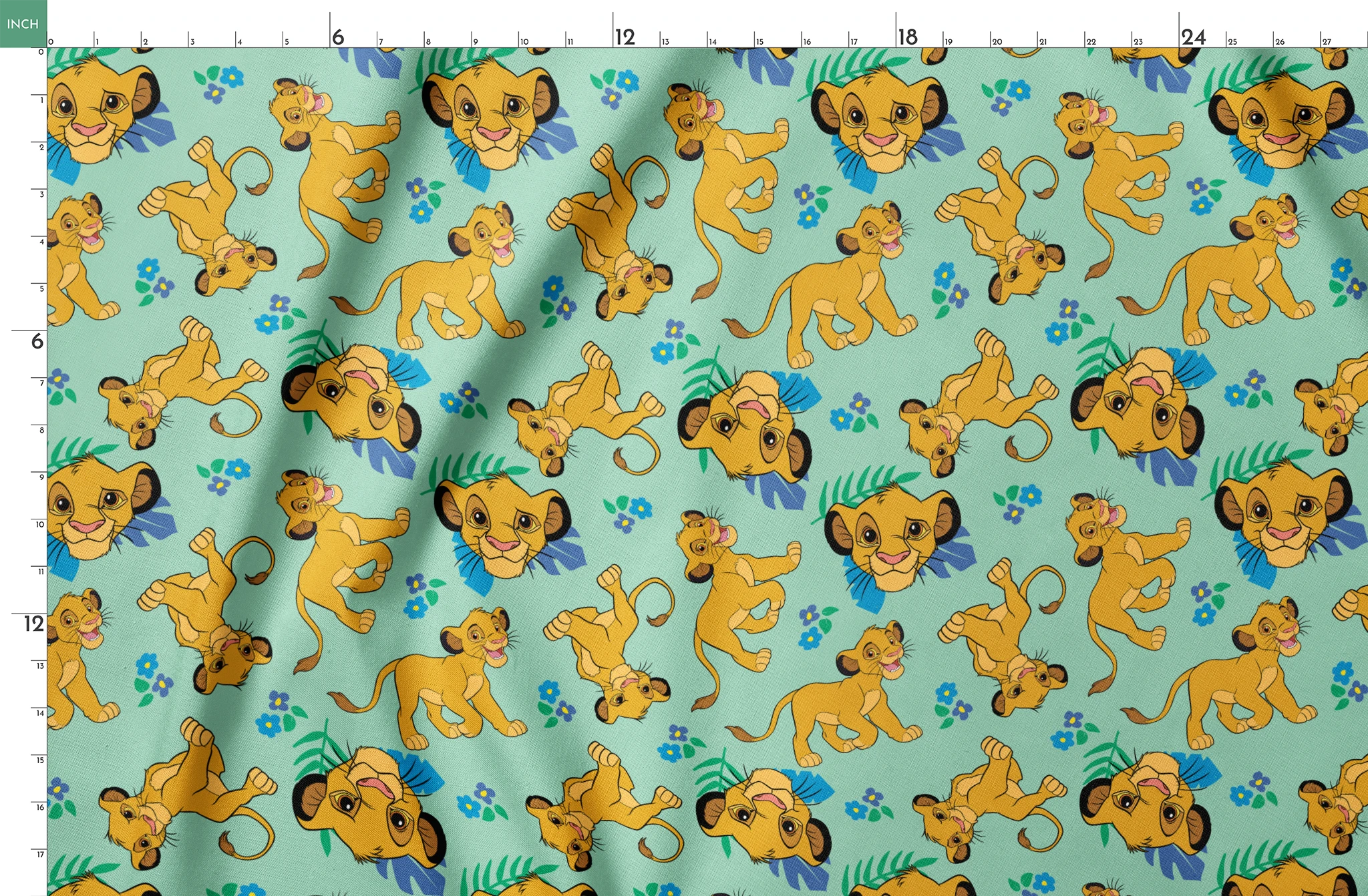 Cartoon lion cubs playing on mint green background with blue flowers and green leaves pattern springs fatquarter mockup