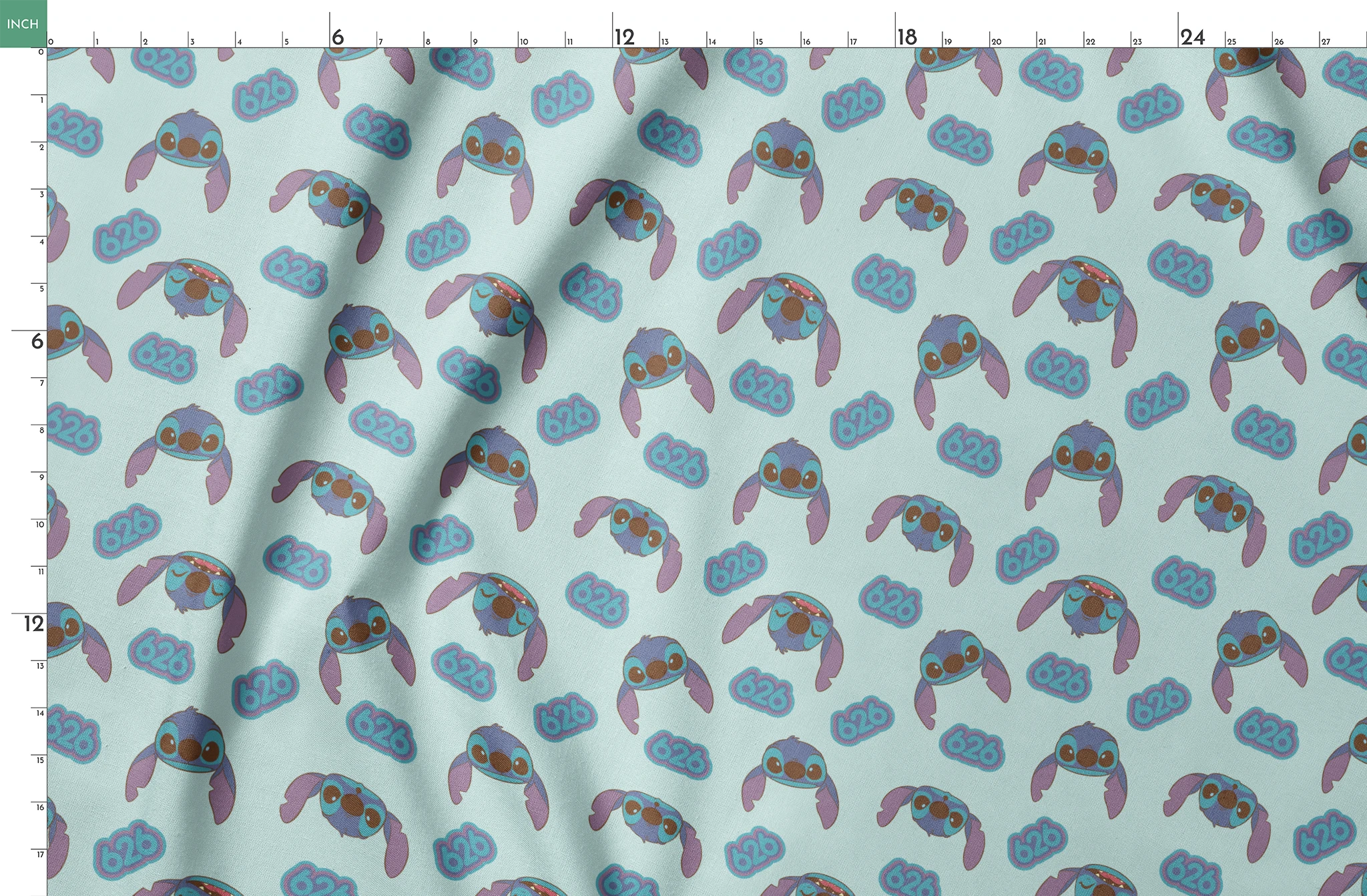 Blue cartoon creatures with large ears and swirl patterns on light teal background springs fatquarter mockup