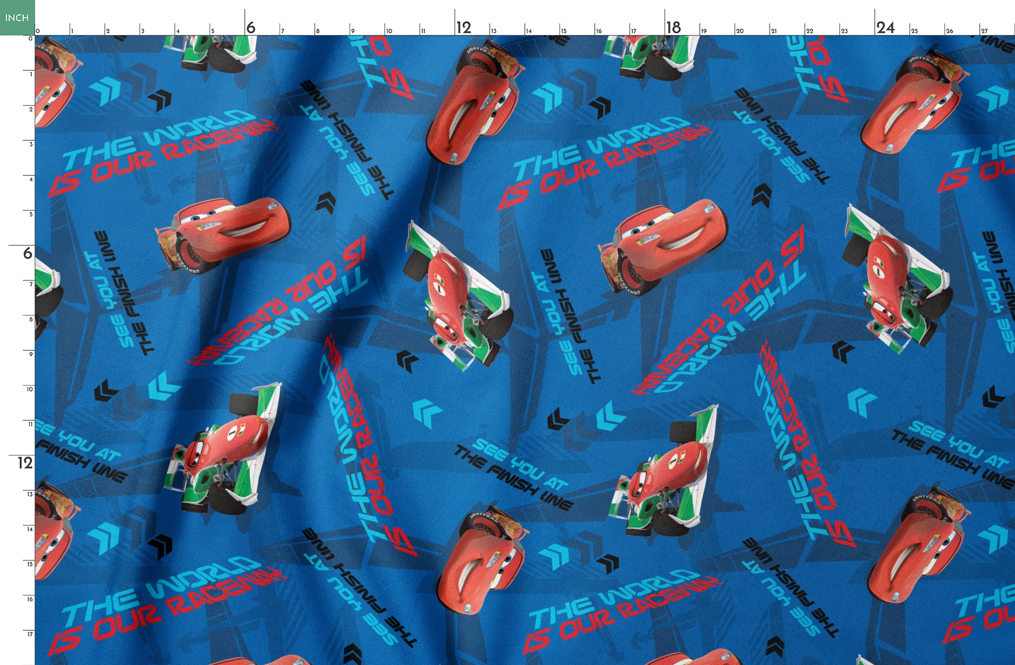Blue fabric pattern with animated red race cars, "The World of Cars" text, and directional arrow designs springs fatquarter mockup