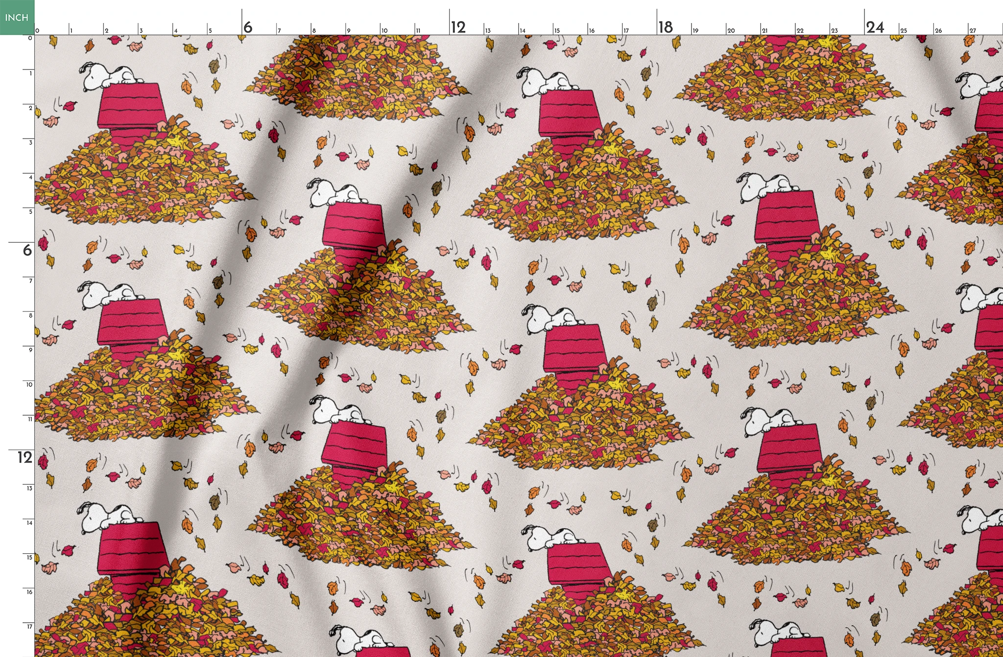 Snoopy and red doghouse on colorful autumn leaf piles with falling leaves pattern on beige background springs fatquarter mockup