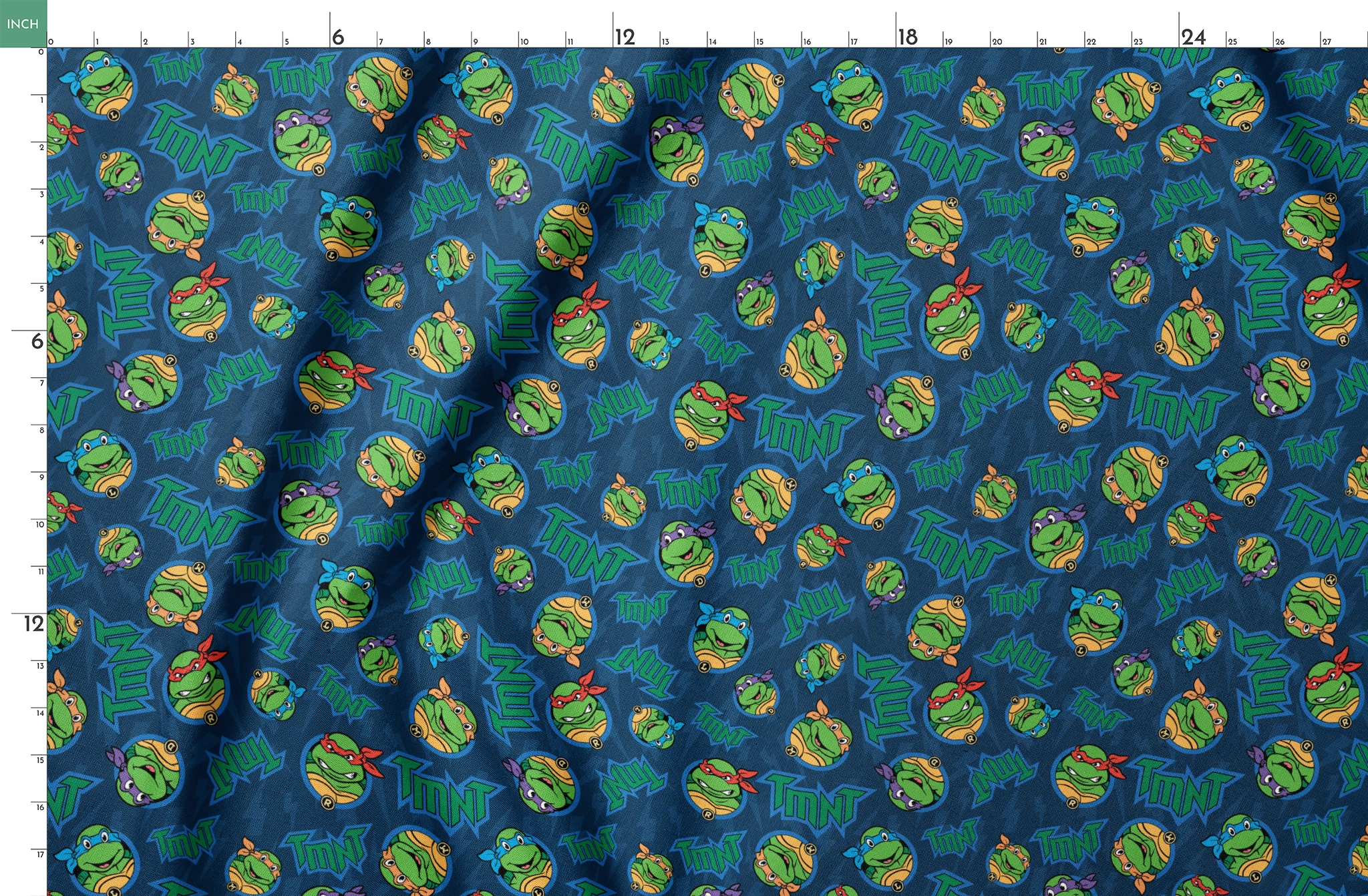 Teenage Mutant Ninja Turtles pattern with character heads and TMNT logos on blue background springs fatquarter mockup