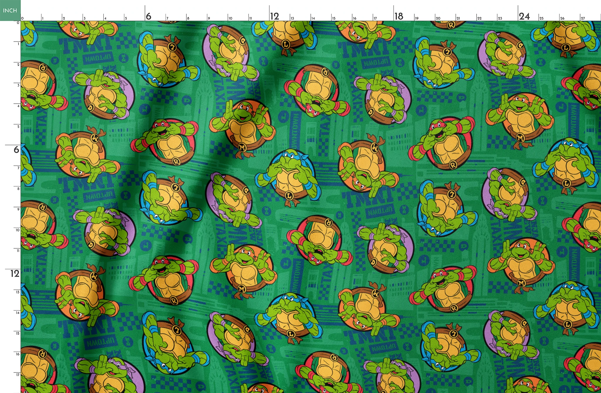 Teenage Mutant Ninja Turtles cartoon characters on green patterned background springs fatquarter mockup