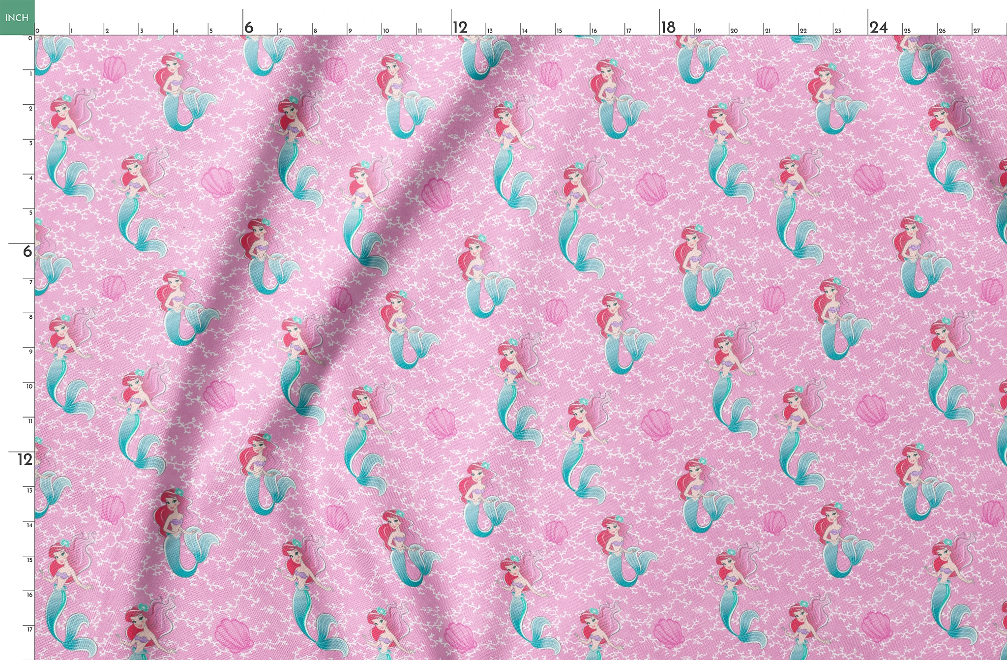 The Little Mermaid pattern with Ariel and purple seashells on pink background with white bubbles springs fatquarter mockup