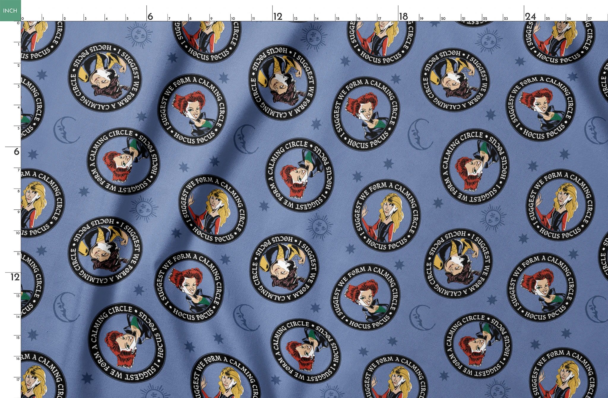 Cartoon witches in circular emblems with "Hocus Pocus" text on blue background with stars springs fatquarter mockup