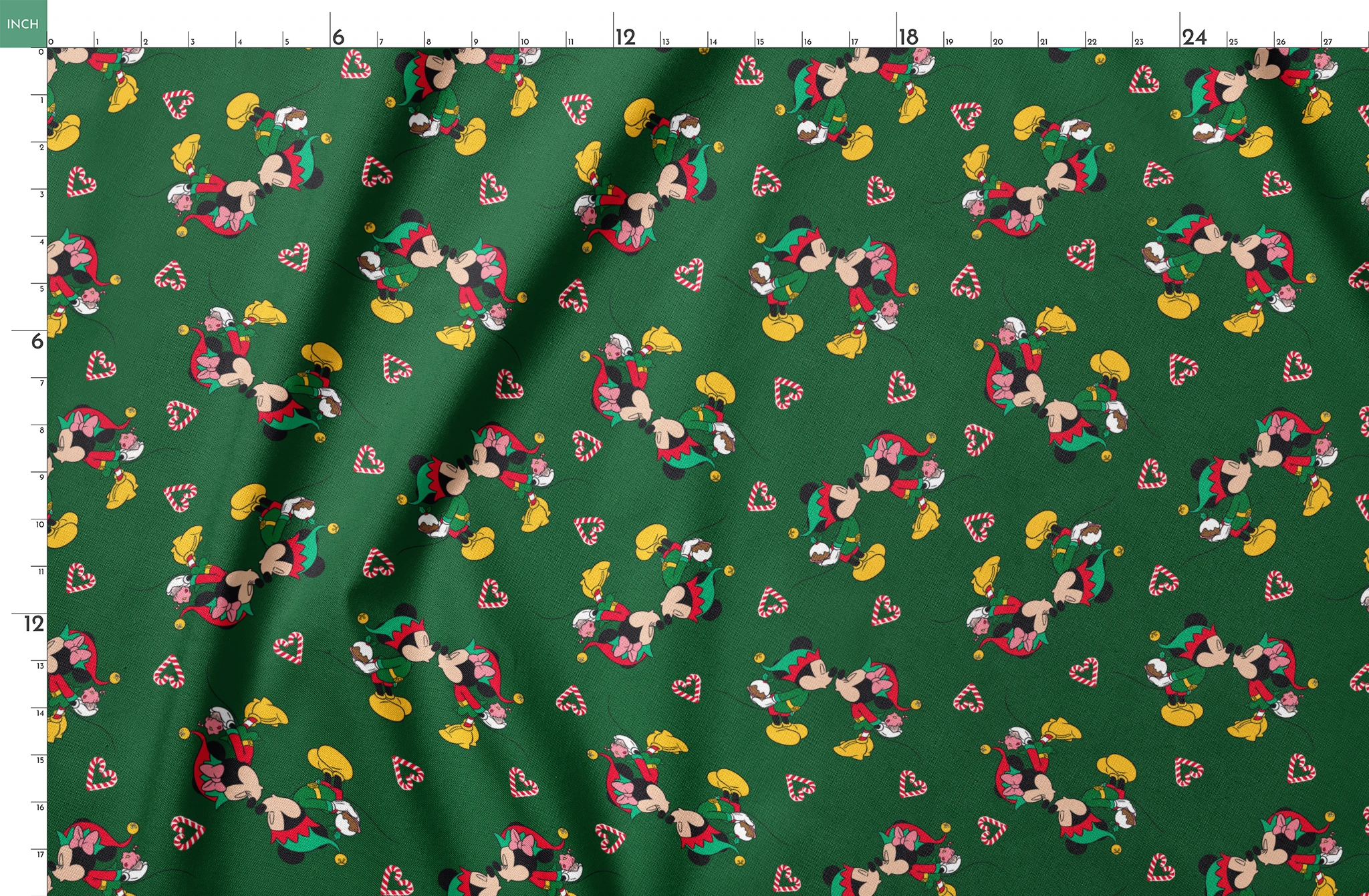 Festive Mickey Mouse pattern with candy canes on green background springs fatquarter mockup