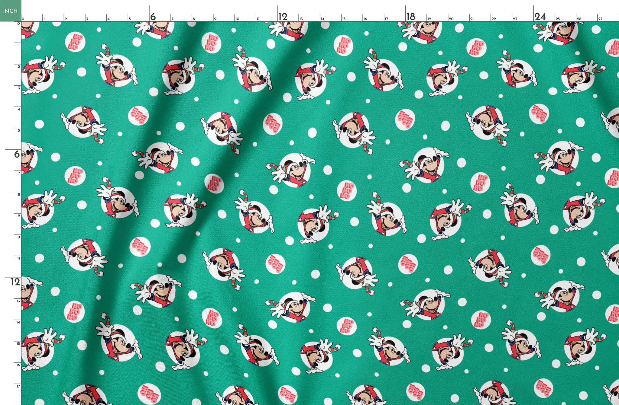 Mickey Mouse in Santa hats on green polka dot background with "Ho Ho Ho" text springs fatquarter mockup
